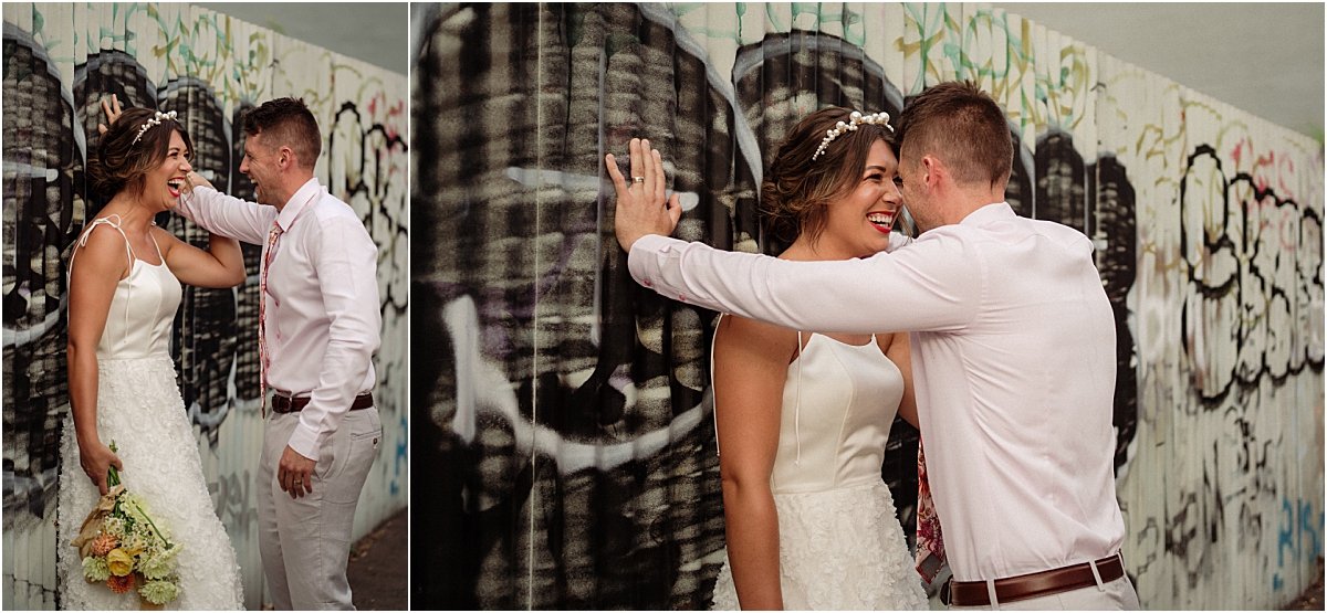 Bride and groom standing in grafitti alleyway in Islington Newcastle NSW