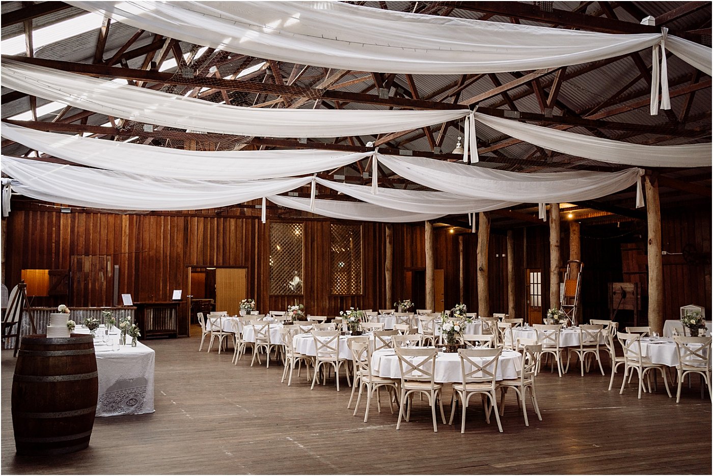 Wedding reception decorated at Woolshed at Riverwood Downs, with ceiling drapery