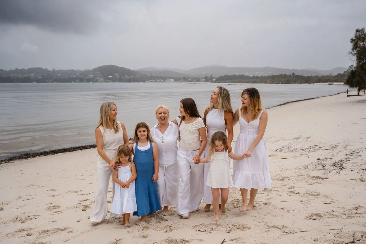 Extended family photoshoot at Corlette, Nelson Bay, on the beach with a storm rolling in