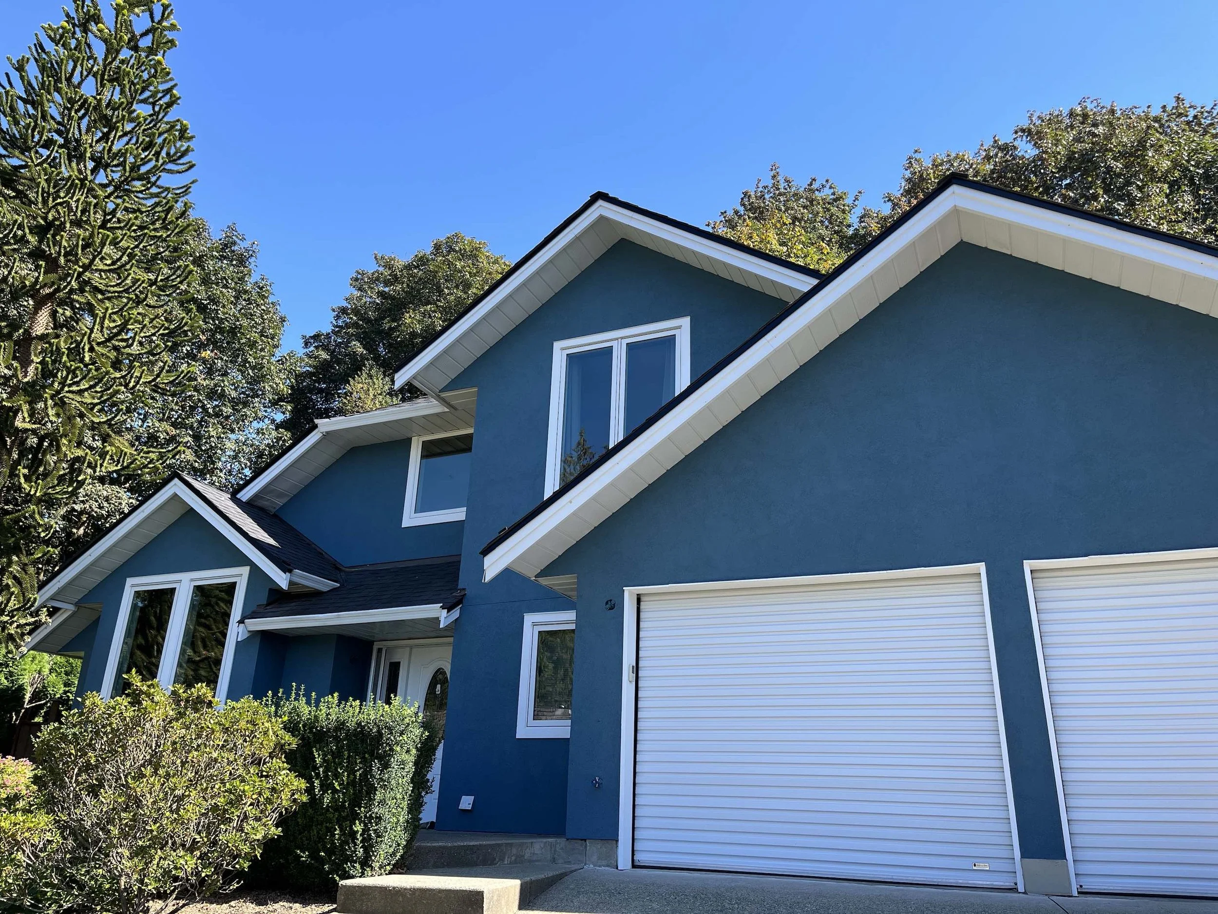 Blue stucco house in Sandy Hill area of Abbotsford