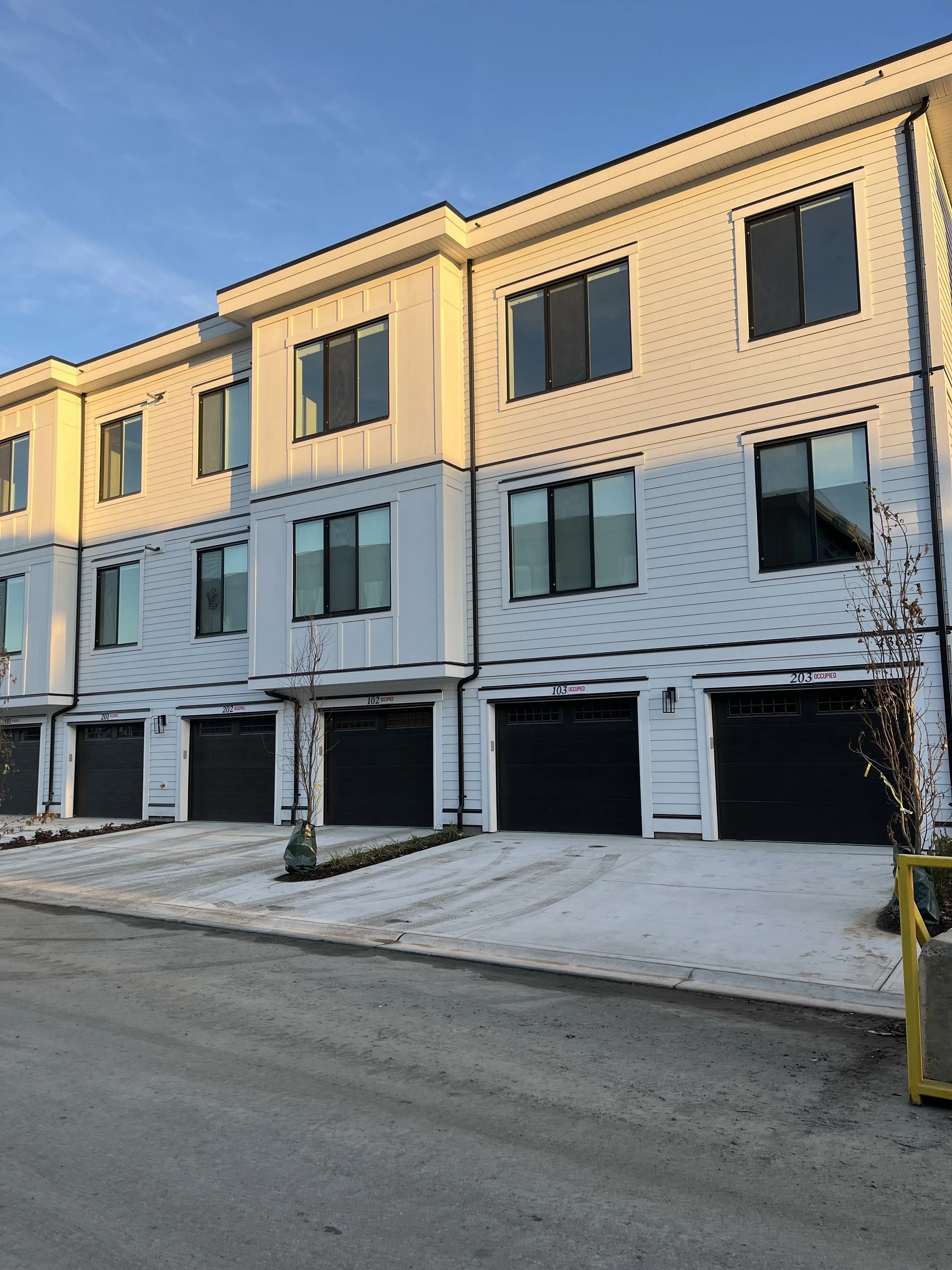 White exterior new construction townhome in Chilliwack