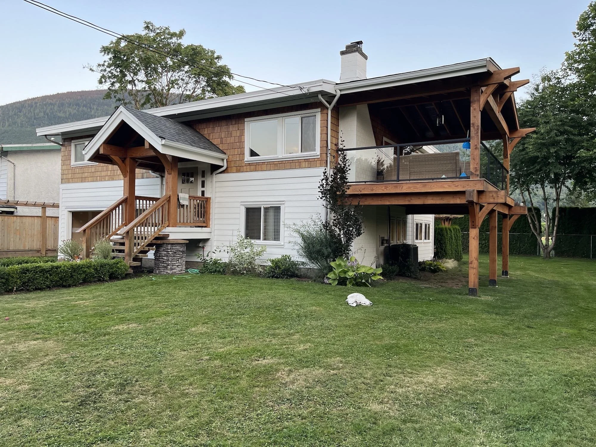 Exterior of a house in Yarrow painted white and stained