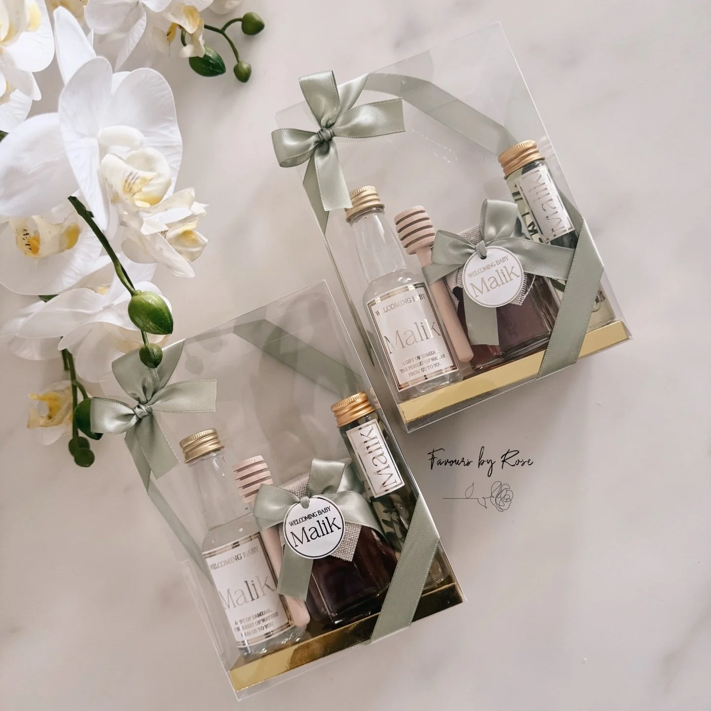 Custom gift boxes, which include our Zamzam bottles, honey Jars and Olive oil, Baby Malik 💚 @favoursbyrose

DM for custom orders and enquiries. 

#baby #birthday #newborn #newbornarrangement #newbornsetup favoursbyrose