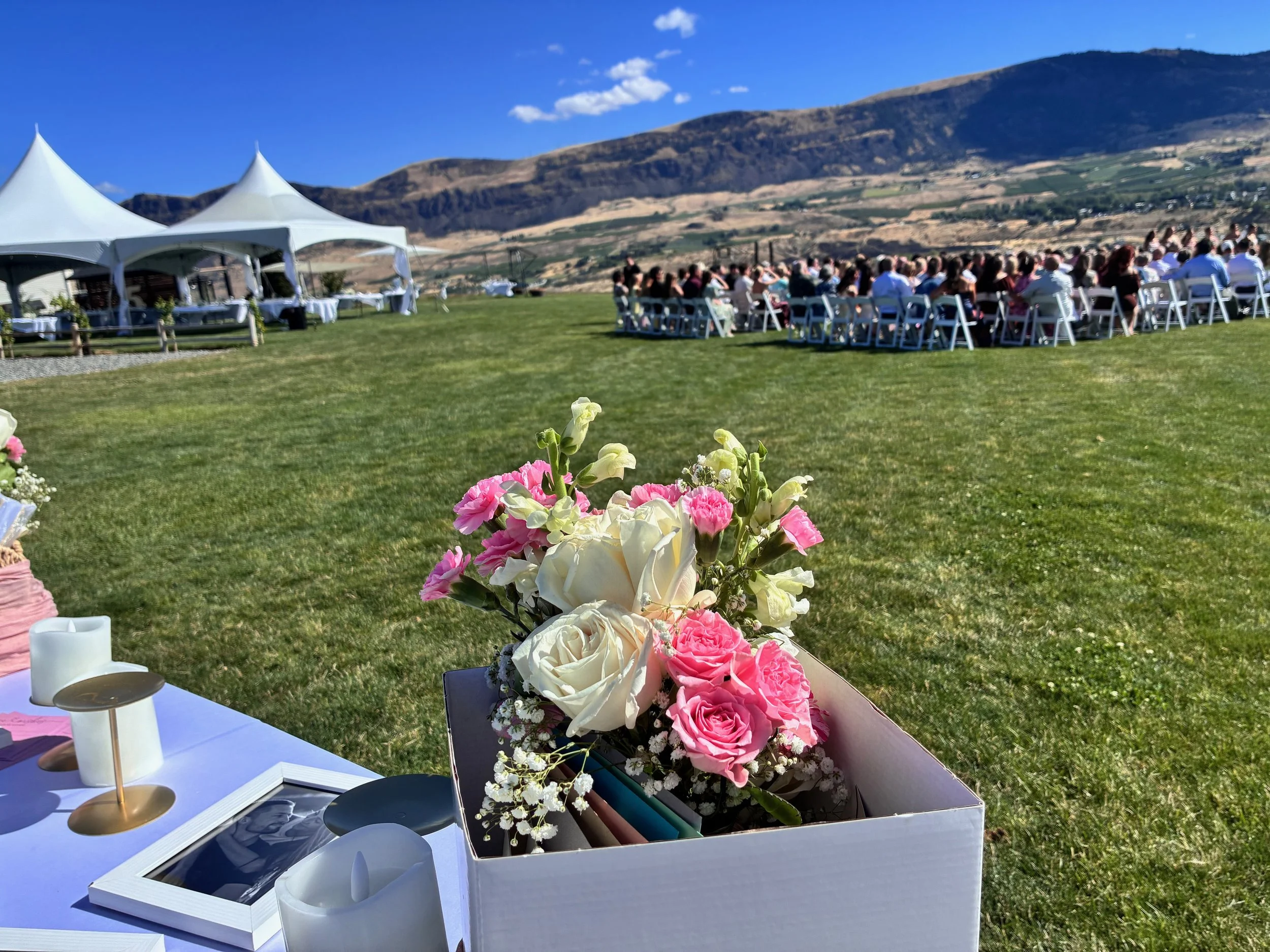 Wedding ceremony and floral setting overlooking the Columbia River Valley at Circle 5 Winery