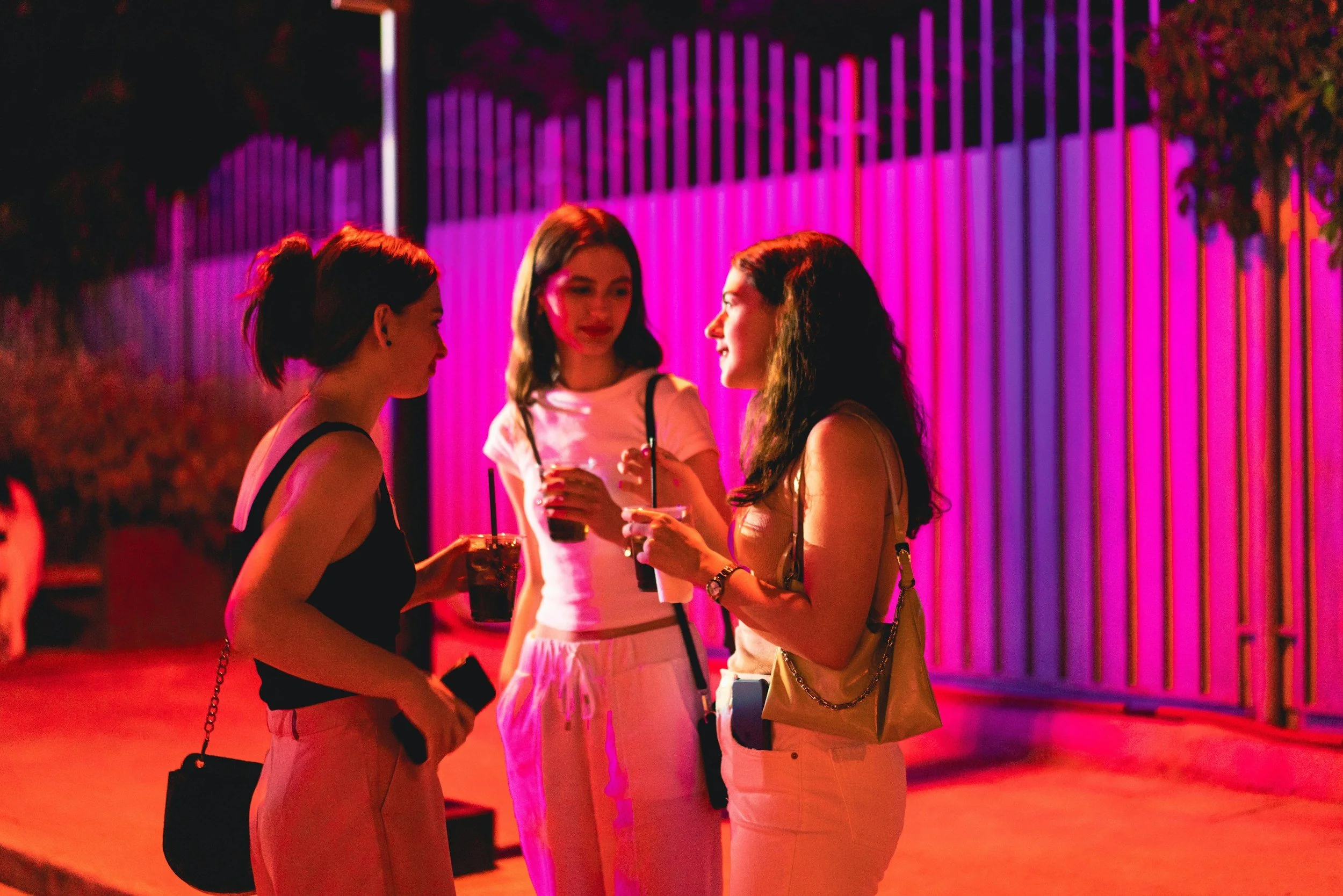 person with friends or community adjusting their expression before entering a room