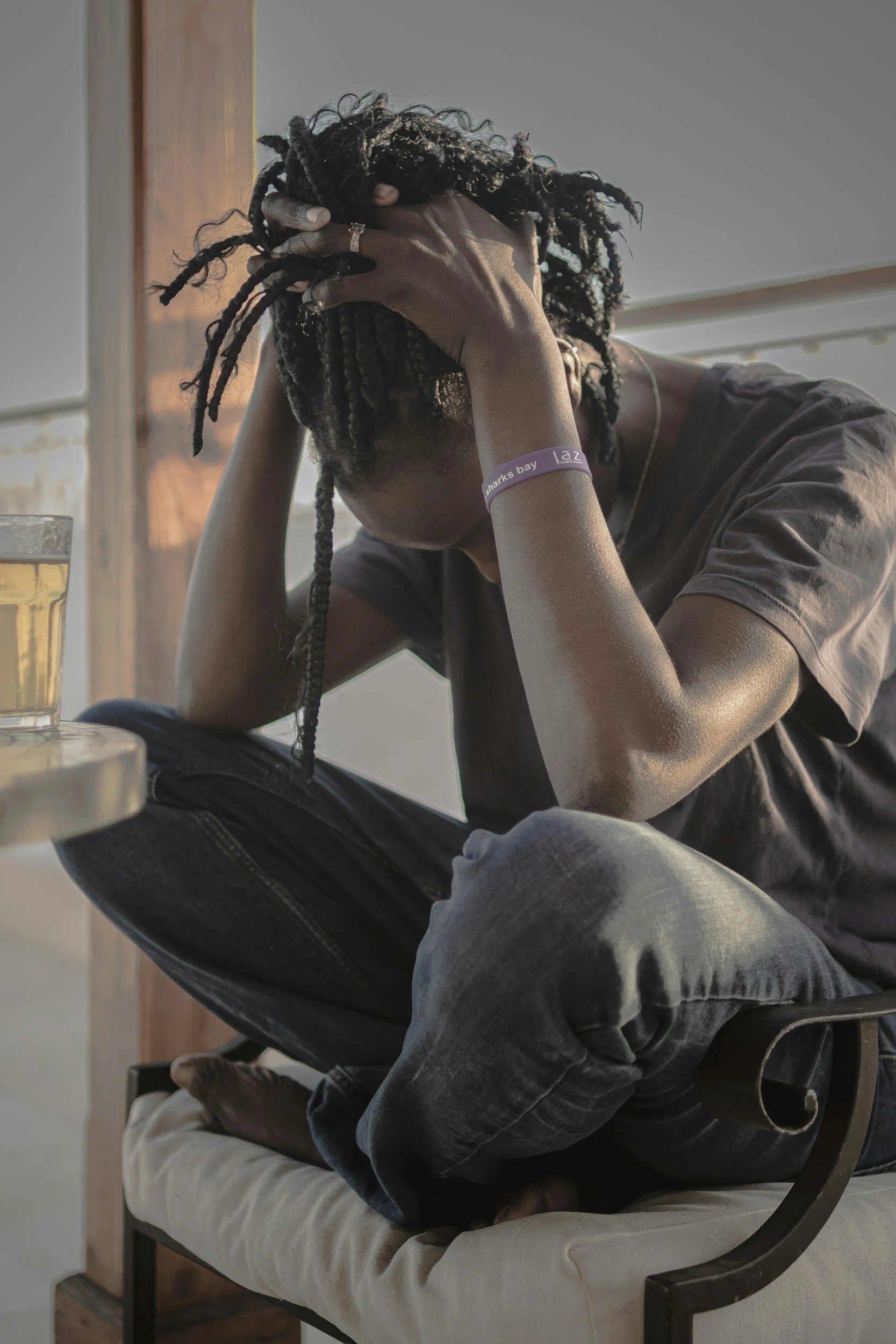 Exhausted person resting their head on their hand at the end of the day