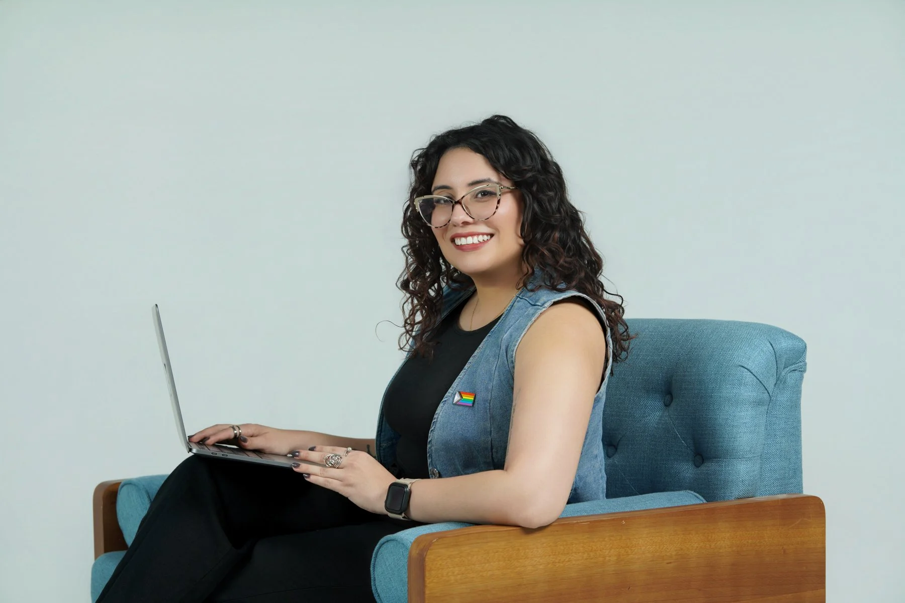 image of latina female identifying therapist with glasses sitting down getting ready for session to help treat anxiety in adults