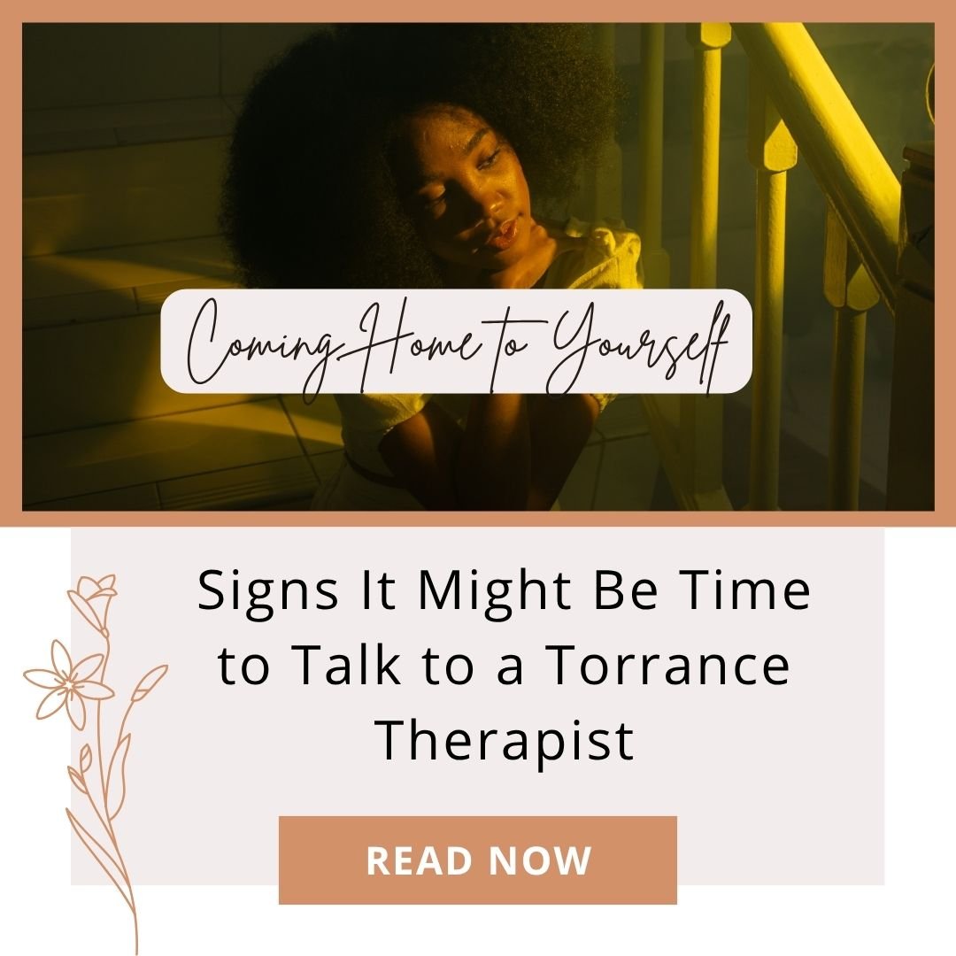 Person quietly reflecting, considering signs it's time to talk to a therapist