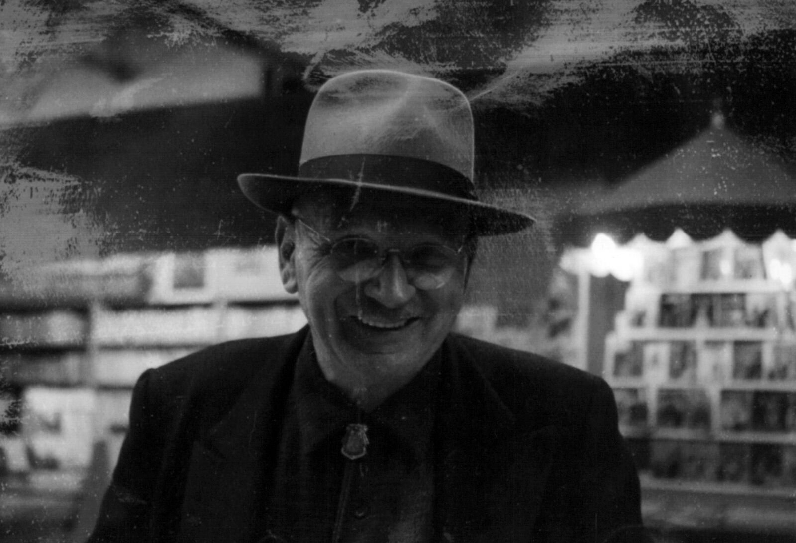 Leon Brendel smiling with a hat on.
