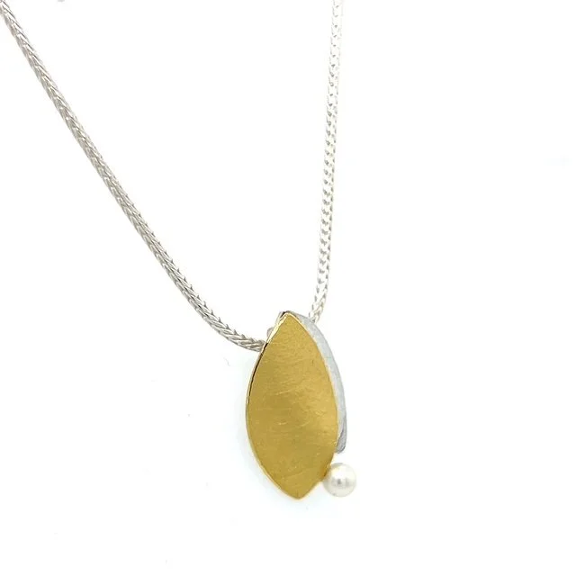 manu-gold-petal-pearl-pendant.jpg