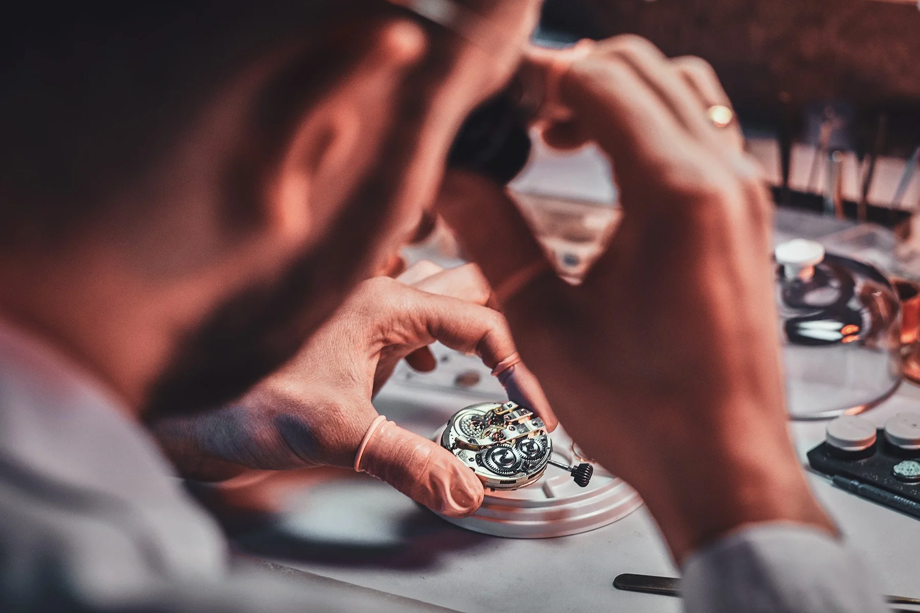 the watchmaker repairs the mechanical watch