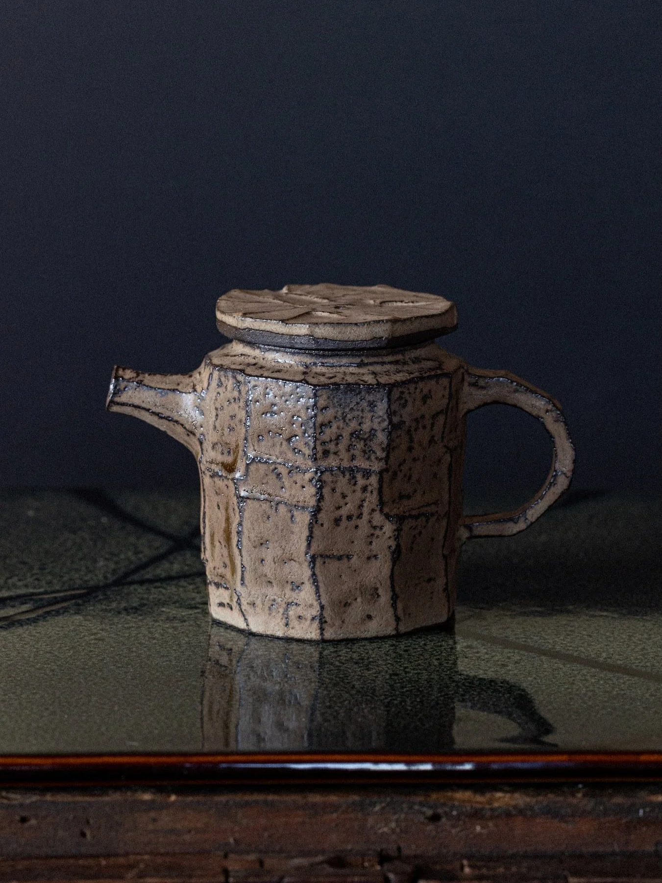 Small kurinuki-style stoneware teapot with a woodash glaze.

As you&rsquo;ve probably noticed, I&rsquo;ve been making a lot of teaware lately &mdash; trying to balance functionality with the kind of aesthetics I love (not always the easiest task!). T