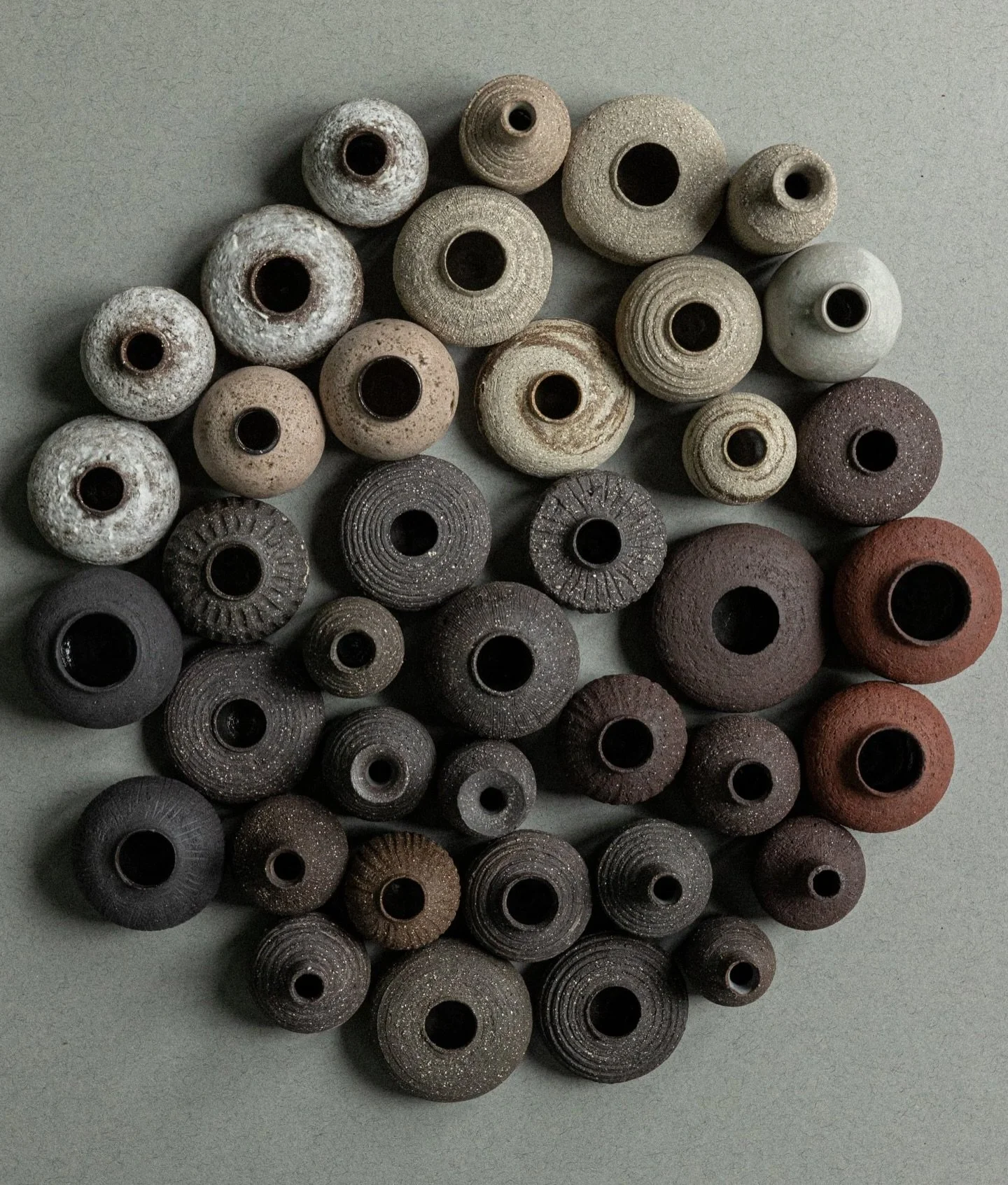 Little stoneware leftovers turned into tiny vases ✨
Each one made from 70&ndash;90g of clay, collected over time into this moody little circle of textures and tones.
I&rsquo;ll have them with me at Potfest in Glasgow (The Briggait)
28th &ndash; 30th 