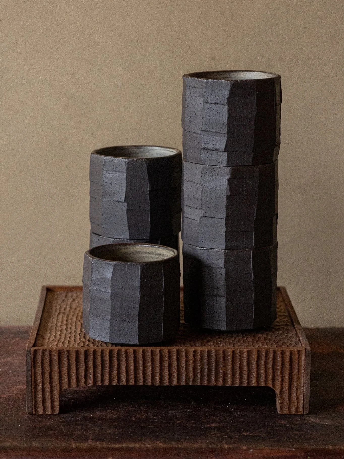 Carved cups in black stoneware clay, wood ash glaze inside. Beautiful wooden tray made by my dad 🤍

#pottery #ceramics #ceramicart #cups coffeecups