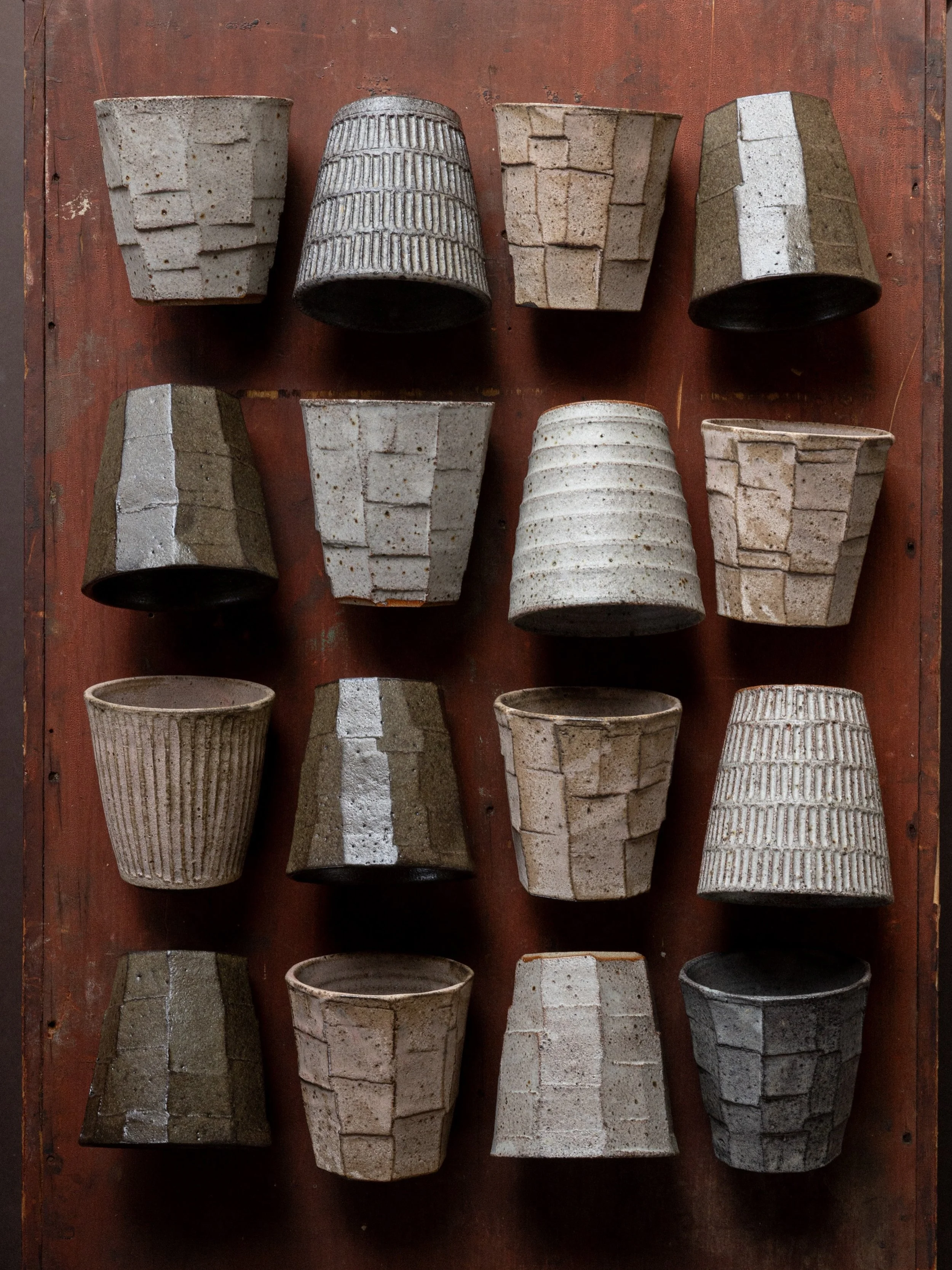 The final batch of wood ash glaze tumblers came out of the kiln this morning.

Pretty pleased with myself for getting 100 pieces made this time around, in a variety of shapes and sizes. Last year I sold out and ran out of them far too quickly.

#pott