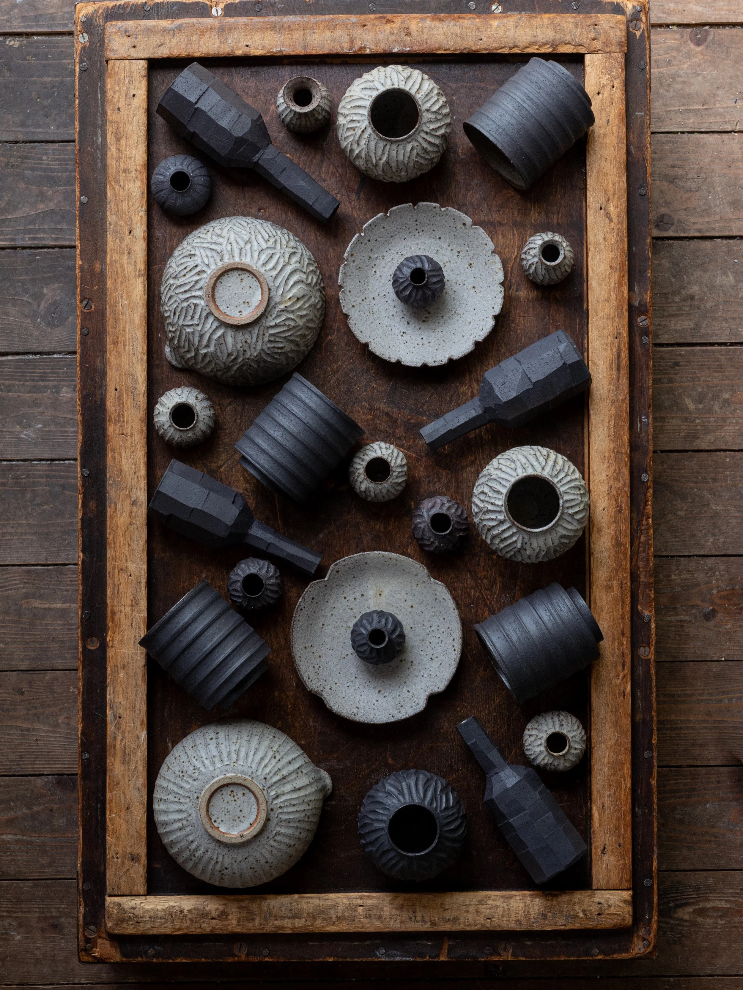 Recent work ready for @potfest. Bottles, matcha bowls, mamezaras, cups, wee vases&hellip;
I always like taking a moment to see the pots together before they leave the studio&mdash;the mix of textures and the black-and-white contrast ties them togethe