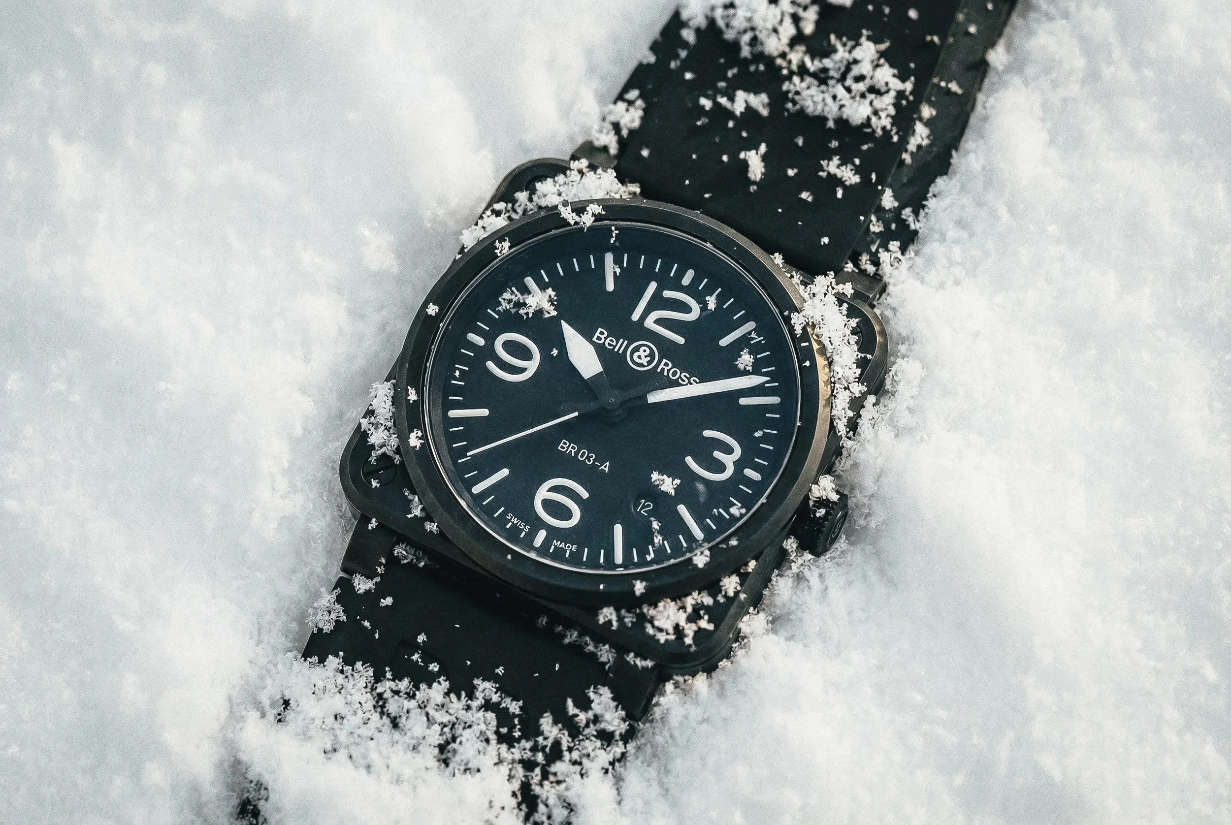 bell and ross br03 watch in the snow, photographed by lifestyle photographer rob ash