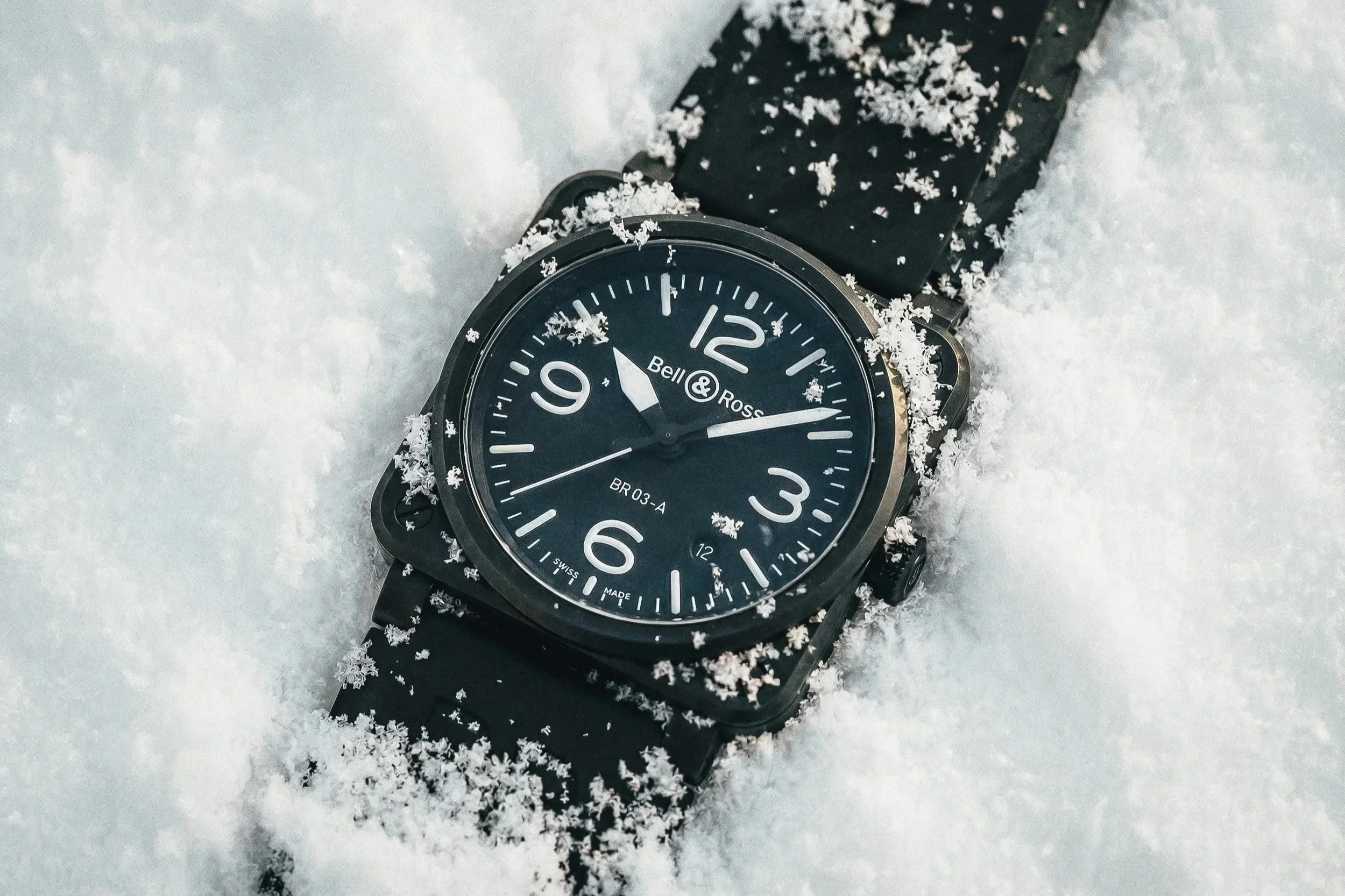 bell and ross br03 watch in the snow, photographed by lifestyle photographer rob ash