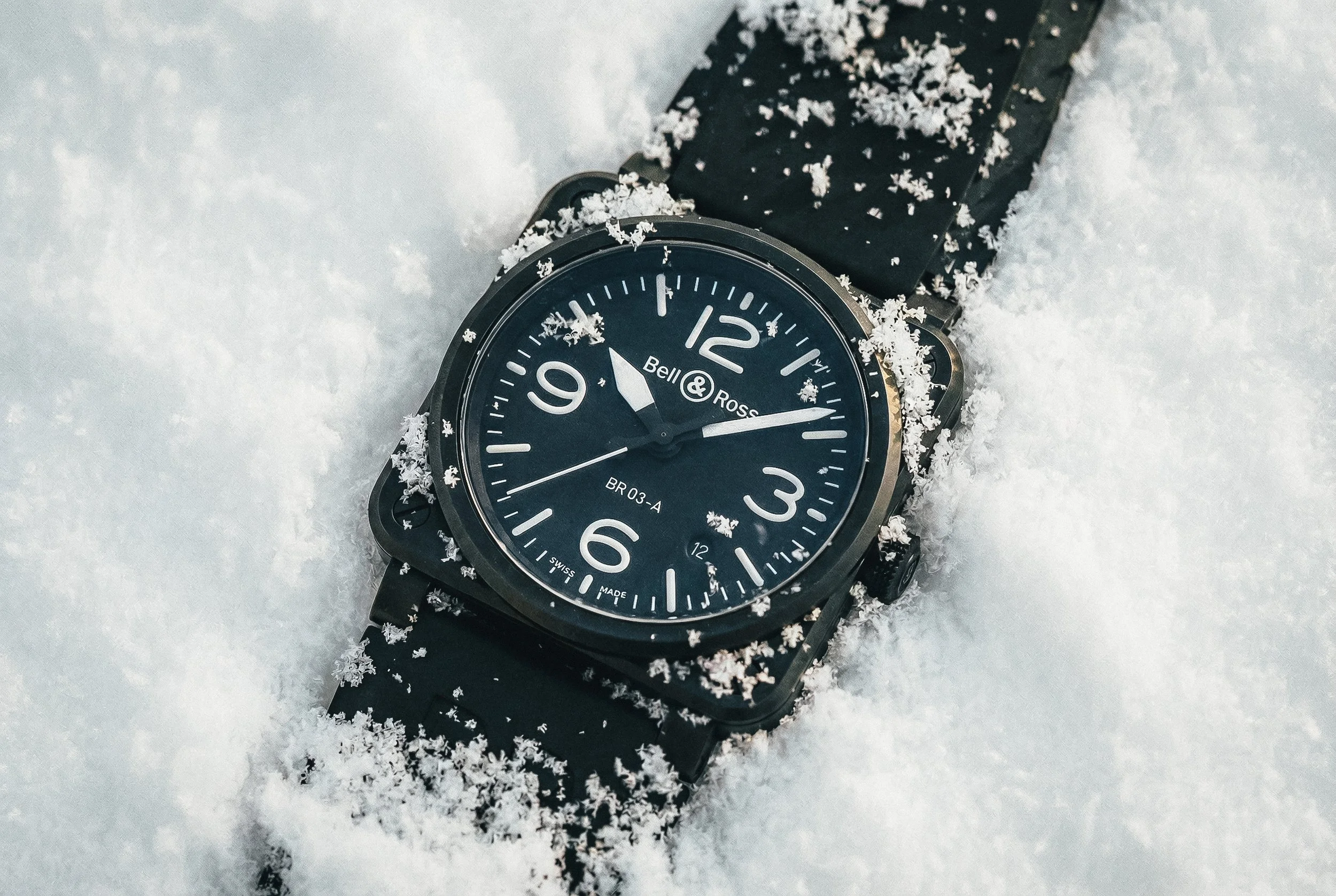 bell and ross br03 watch in the snow, photographed by lifestyle photographer rob ash