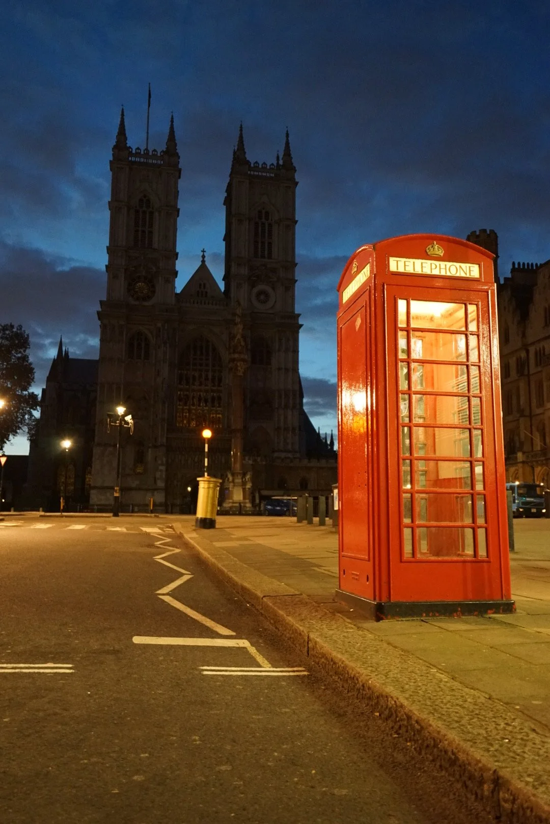 Before London Wakes
London, England  
Unable to sleep, I grabbed my camera and walked the streets of London sometime around three or four in the morning. The city was nearly empty, and this red telephone box stood against the blue-black morning with 