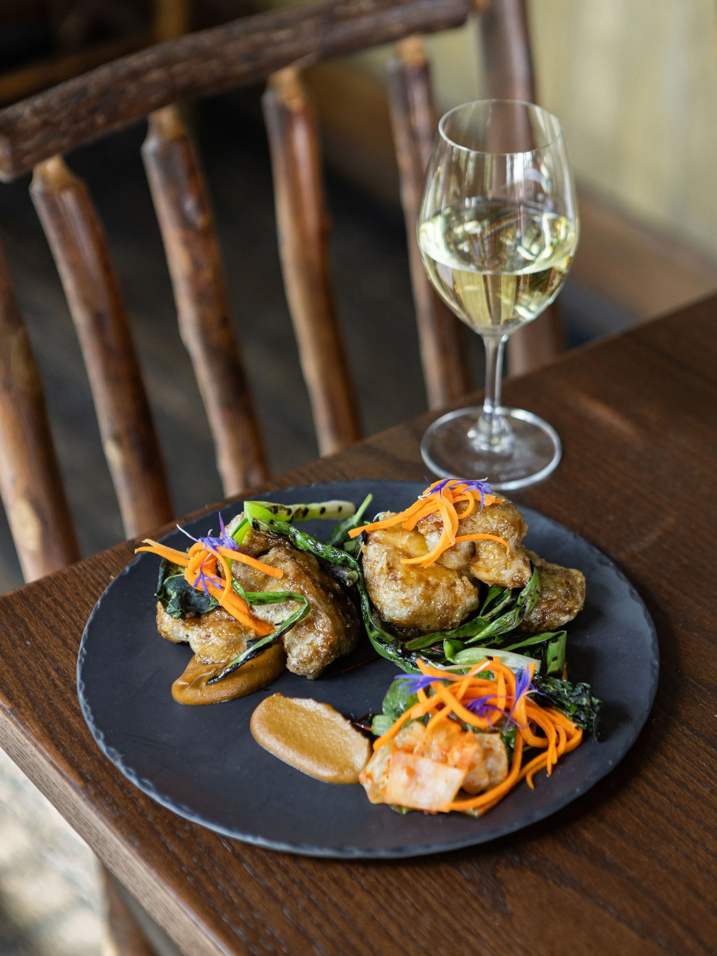 A fall favourite. Trafford Farms Lion&rsquo;s Mane Mushrooms, Southern Skies Scallion, Pickled Carrot, Pepita, Margaret&rsquo;s Kimchi, Bulgogi Glaze. 
#RCkitchenstories #justawalkinthepark #rivercafeyyc #yycfood #lionsmane 
Photo: @py_lens