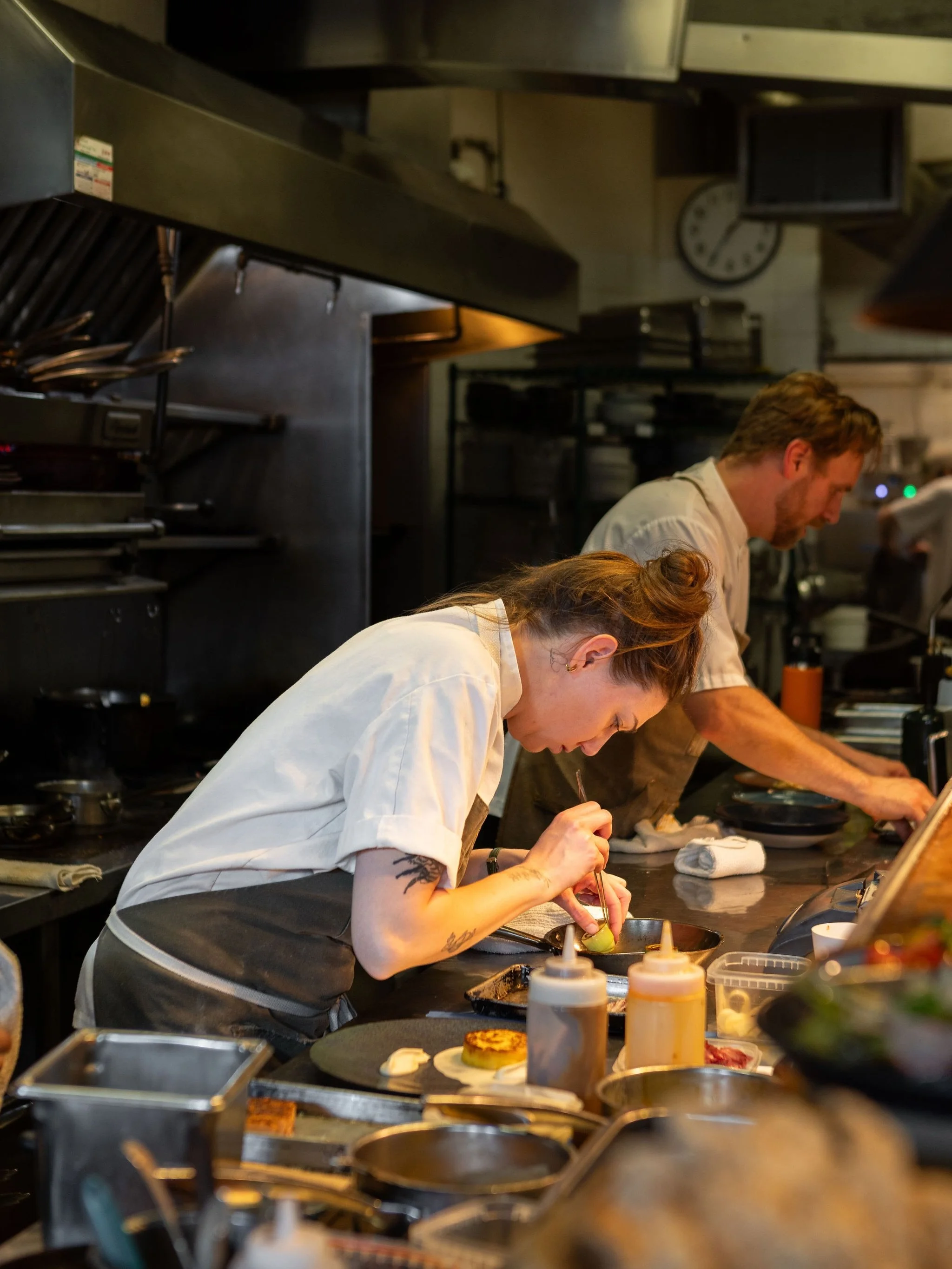 Chef de Cuisine Cass with the final touches on our new Hog Wild Boar Belly dinner entree. Finished with Poplar Bluff Parsnip, Amiable Organics Leek, Panisse, Grilled Radicchio, Apple and Brandy Gel. 

#fallmenu #RCkitchenstories #rivercafeyyc #yycres