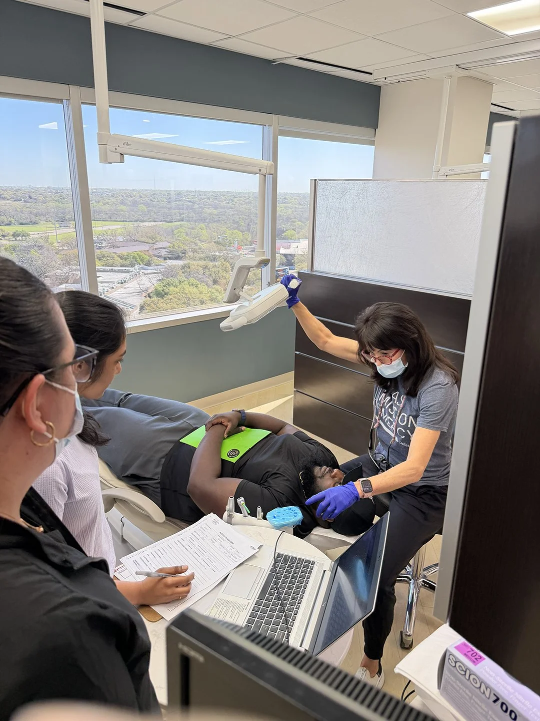 Dr Audrey Stansbury examines a patient during a prescreening event.jpg