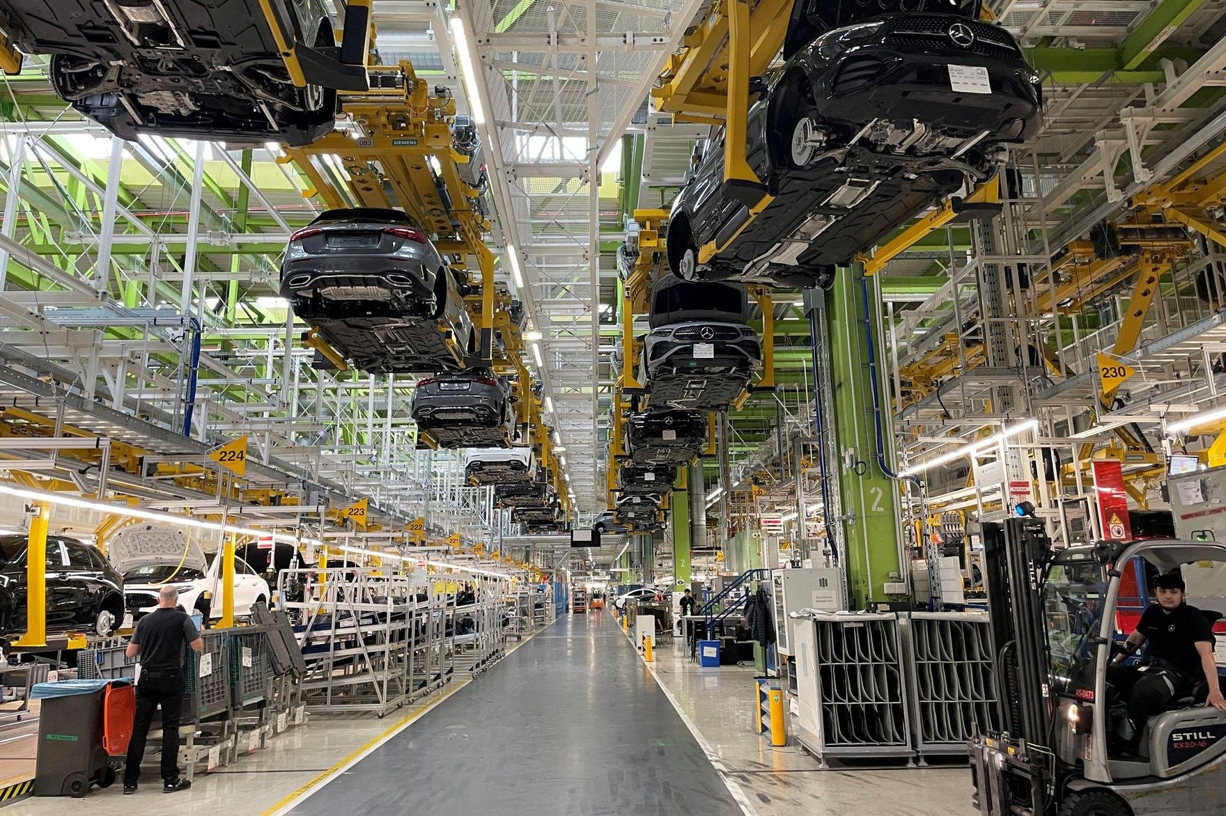 wide shot of inside a car manufacturing factory