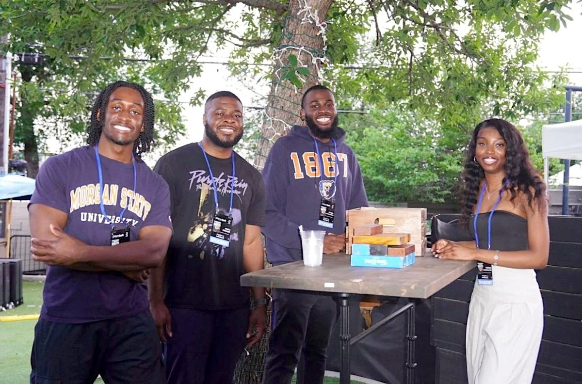 Team HAX Lab members (from left) Jaden Reeves, Osita Odunze, Daniel Onyejiekwe and Fikewa Akindolire earned first place in the 2026 PROPEL Center Future of Tech Innovation Challenge. They stand outside around a table.