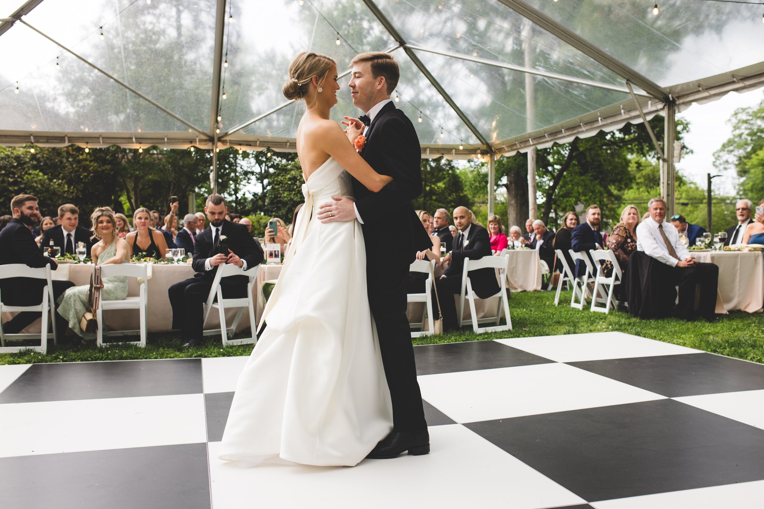 Spring-Garden-Wedding-Couple-Under-Clear-Top-Tent.jpg