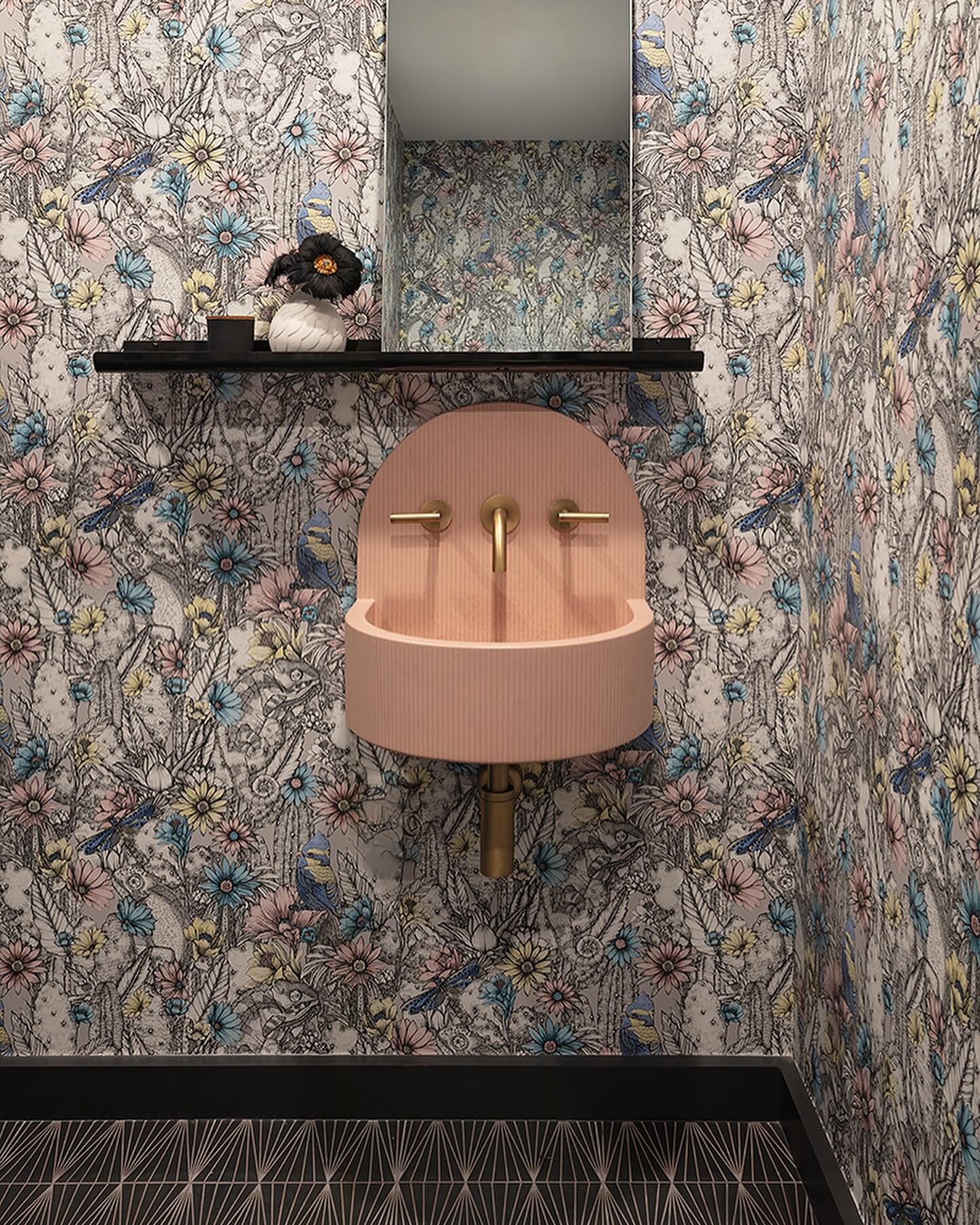 From plain to picturesque, this powder room underwent a major upgrade: Think heated floors, a high-tech toilet, captivating wallpaper, and this chic ceramic sink! Dreams really do come true for our delighted homeowner.

Have you experienced the Perez