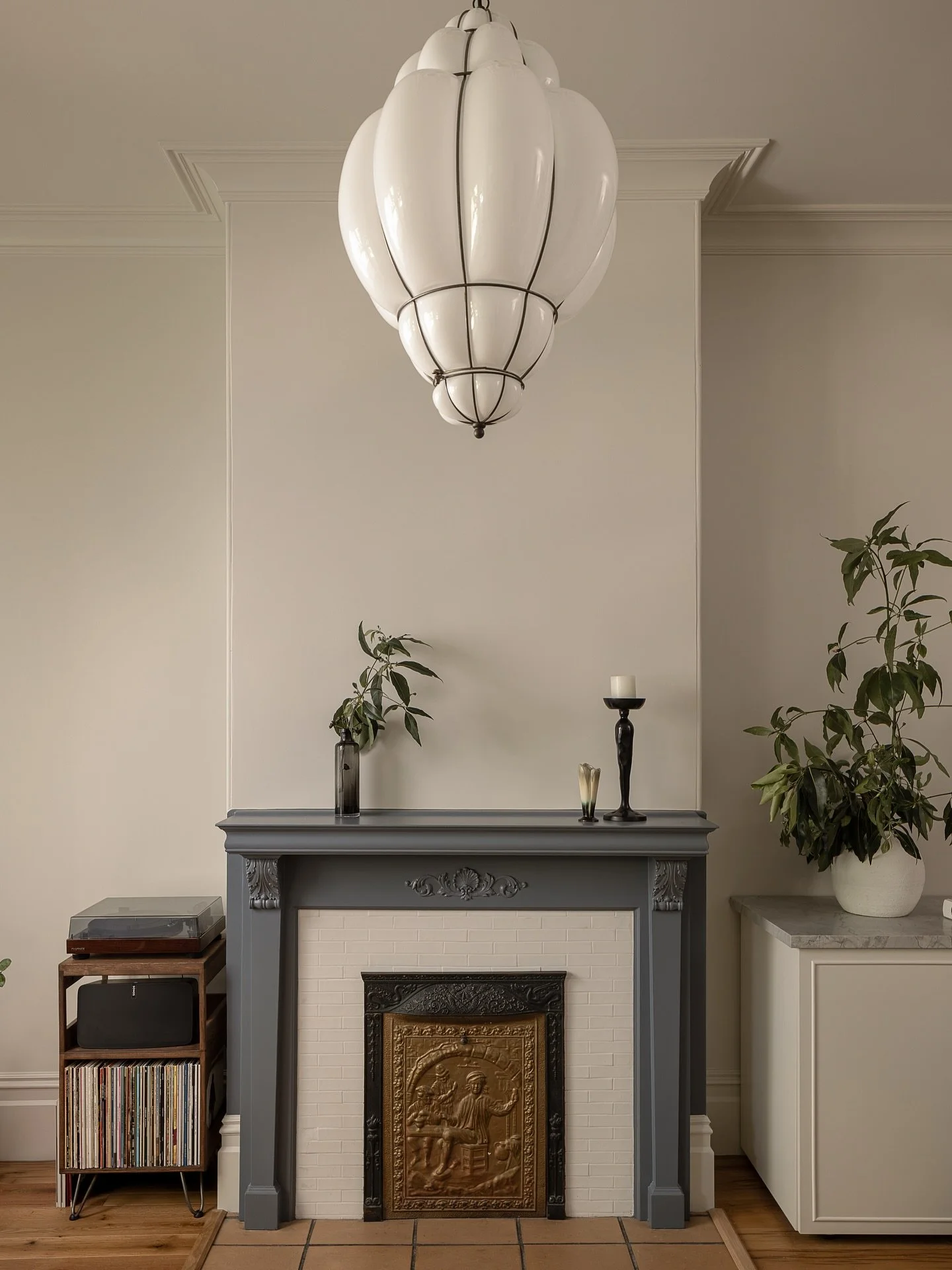 In this project, we had the chance to showcase two details that balance restoration with modern upgrades.

📸 1: The mantle over the decorative fireplace sits beneath hand-blown Murano glass fixtures. By restoring the home&rsquo;s ceiling height, we 