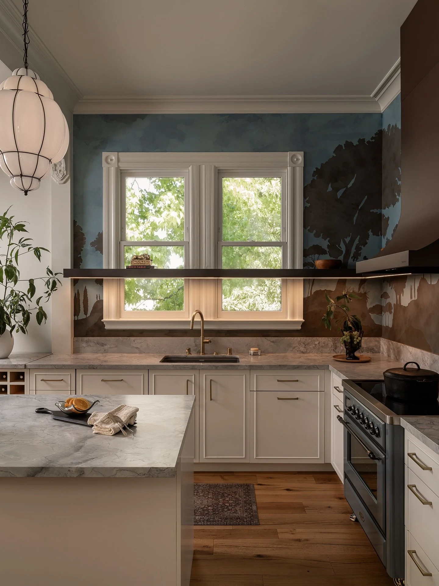 In our Ashbury Heights project, we restored the home&rsquo;s original 11-foot ceilings and introduced modern appliances that disappear seamlessly into custom cabinetry with inset panels and soft detailing. This renovation brings a turn-of-the-century