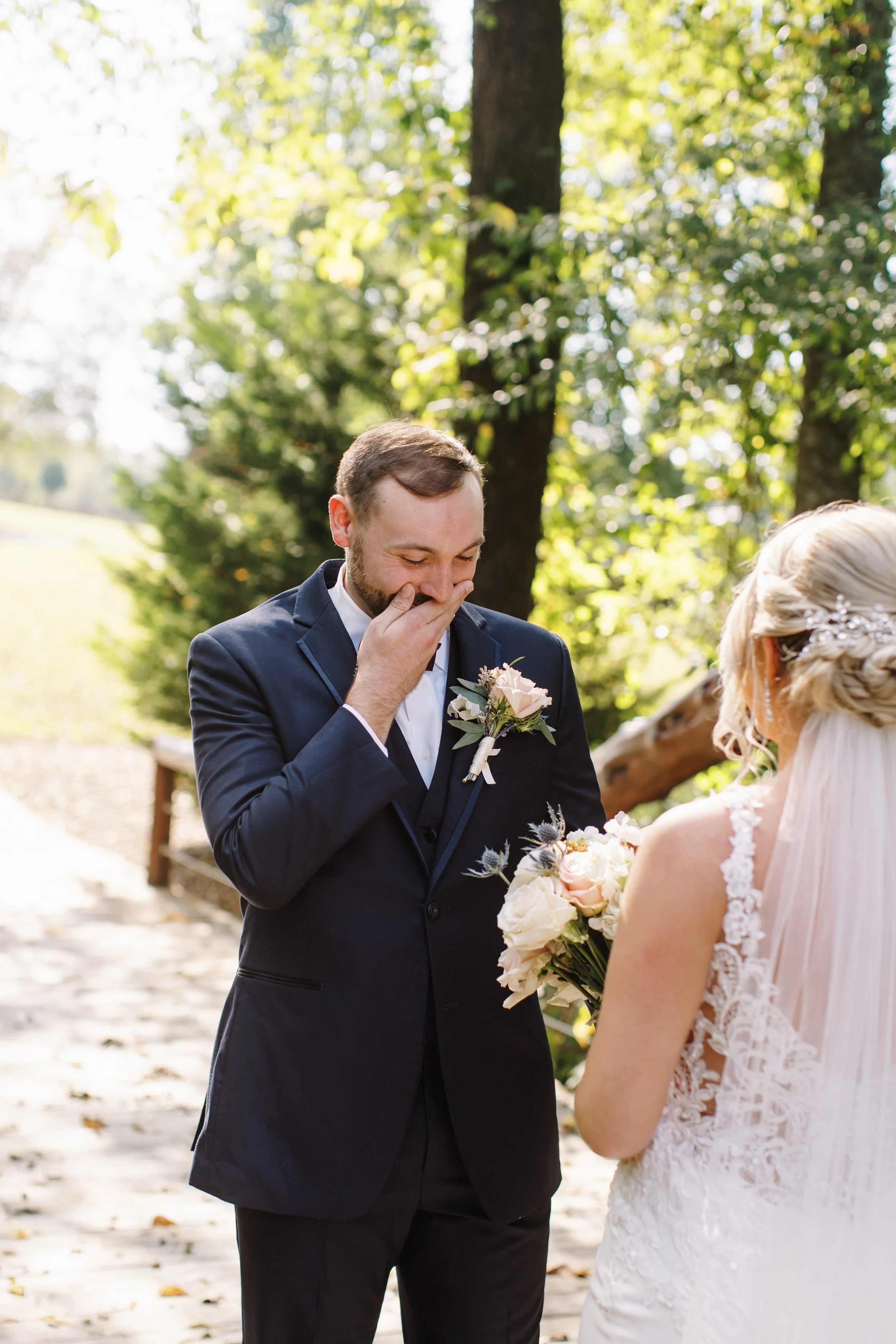 Groom crying at first look with bride outside