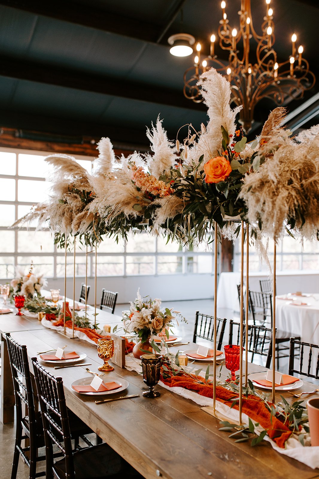 boho head table tall gold stand pampas grass and florals.jpg