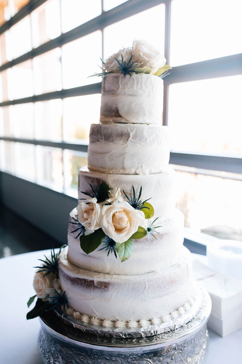 ocoee crest wedding venue summer wedding wedding cake with florals.jpg