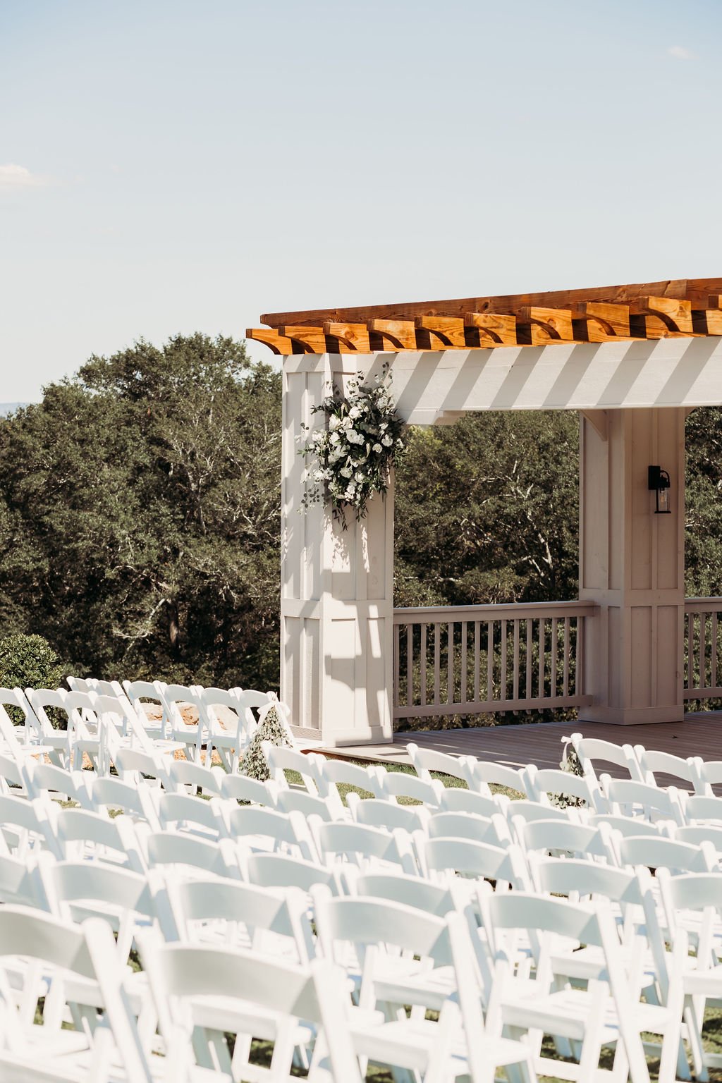 ocoee crest wedding venue florals in the corners of the ceremony pergola.jpg