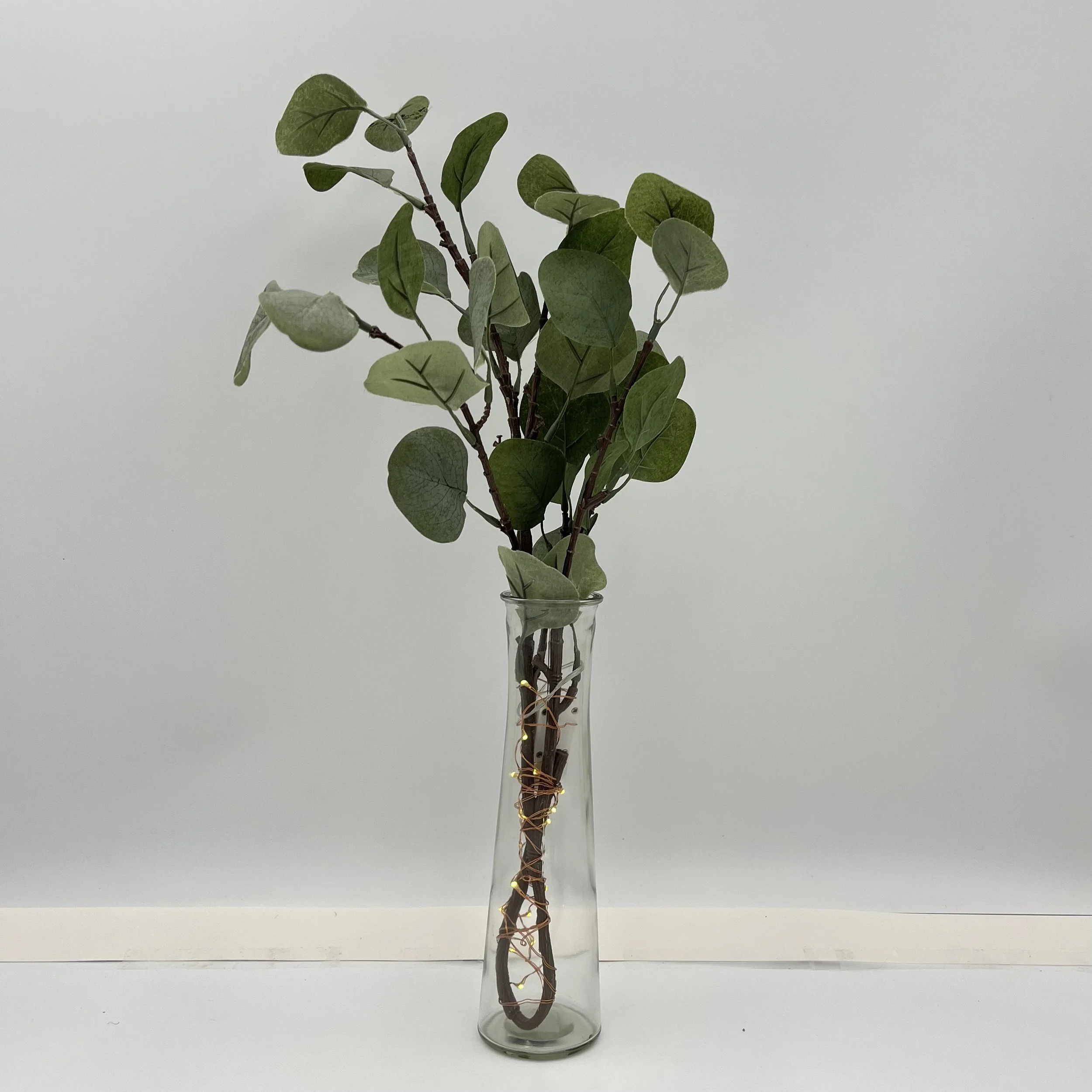 eucalyptus with fairy lights in vase.jpg