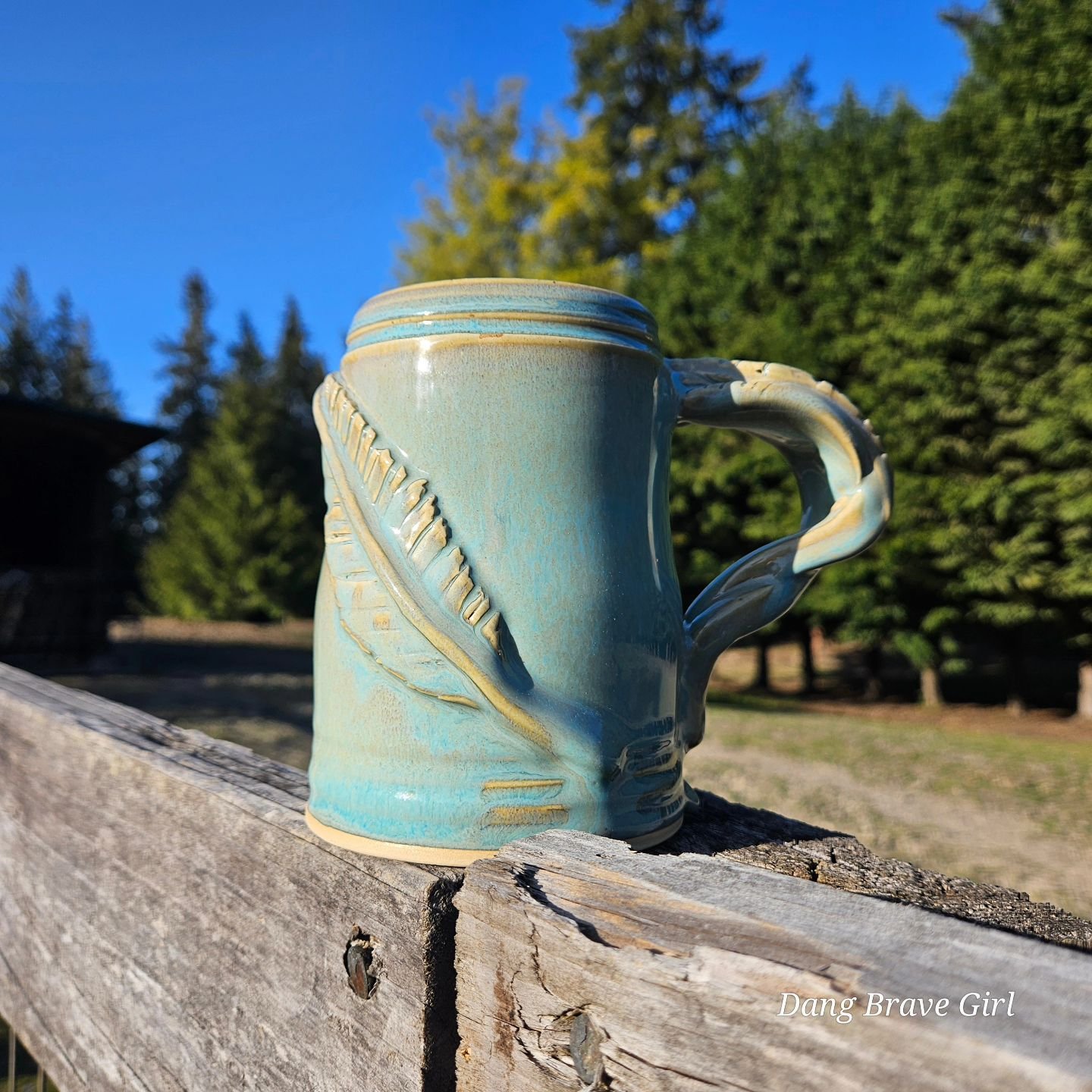 Who's ready for a DBH mug update? 

These 2 feather mugs are so unique and obviously ooak... look at those handle details! 

And the cross mug came out of the kiln with some extra bubbles, and while still completely usable and cool as is, I will disc