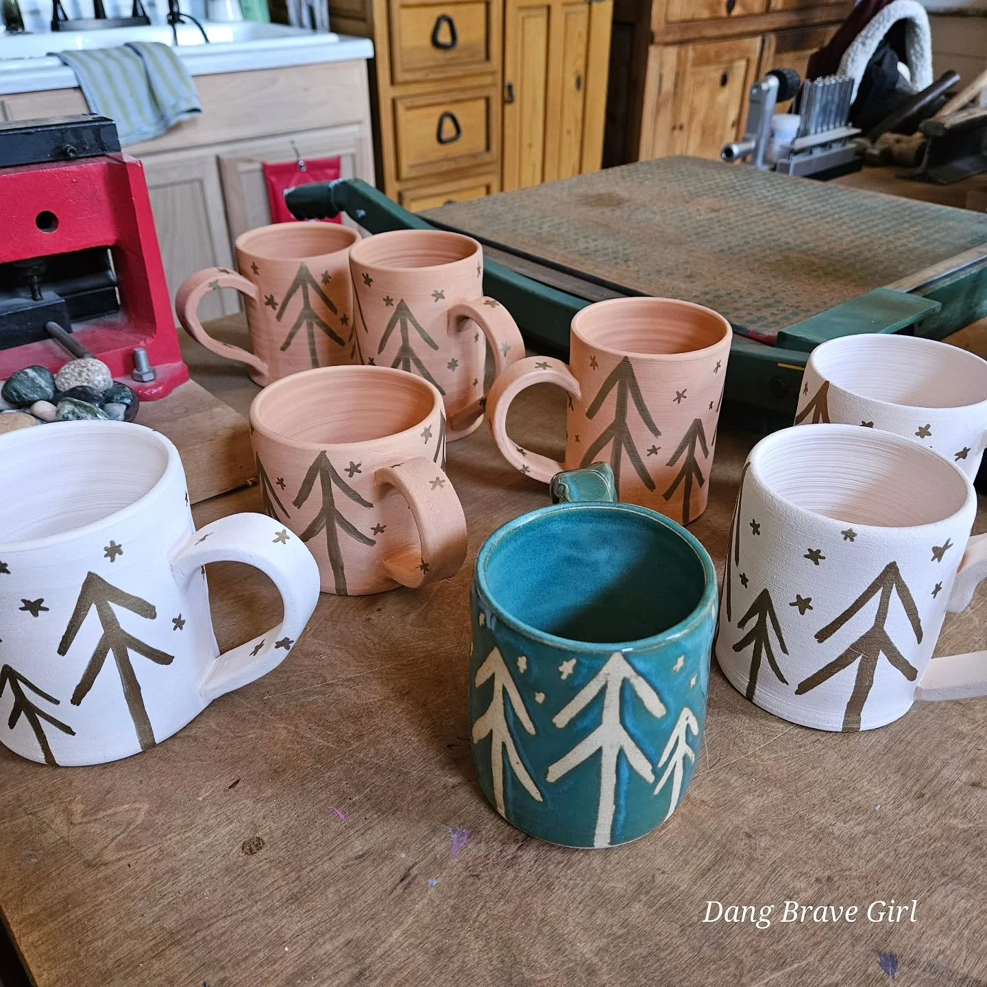 Can't tell me nothin'....cuz I love my funky trees.

My first one, the glazed one in the front, inspired more and the DBH got busy making some 'plain' mugs for me to have my way with! These will get their final glaze and go in the kiln later today. W
