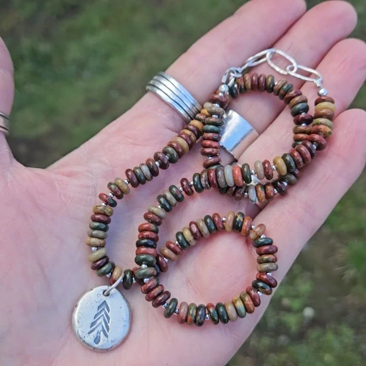 If these beads look familiar it's because I am in love with them and made another necklace with them! A chunky Live Edge tree pendant, random sterling beads and all those gorgeous, earthy colors are amazing together.
I even made a couple pairs of 'ma