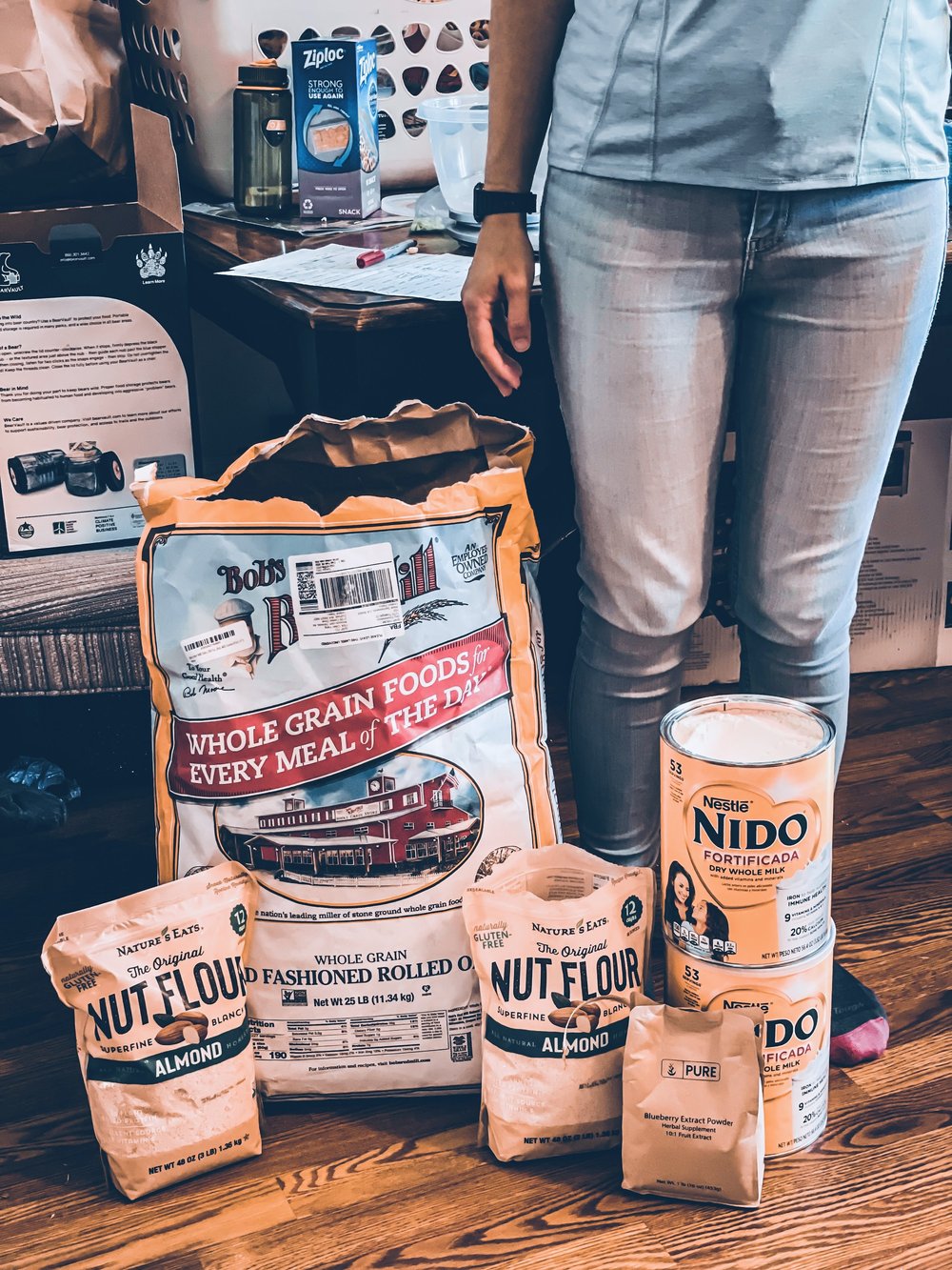 Person stood next to giant sack of oats