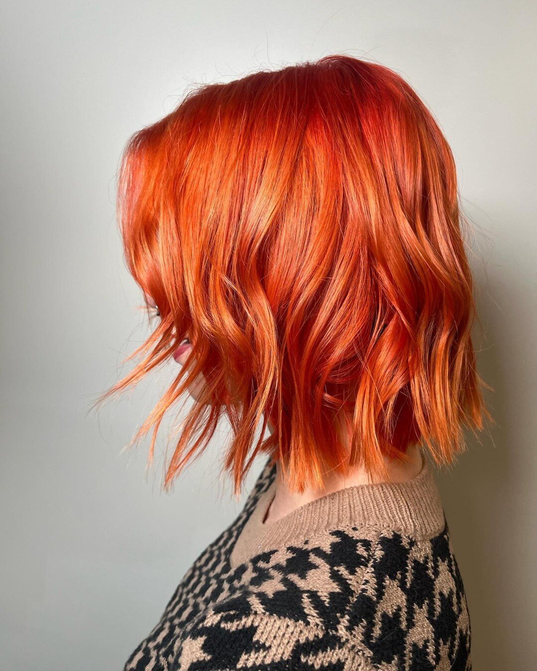 Ready to bring a pop of color to your 2024? Give us a call! We can't wait to consult with you on what kind of color appointment will help you achieve your dream hair! This fiery vivid orange is by @lexmckinney!