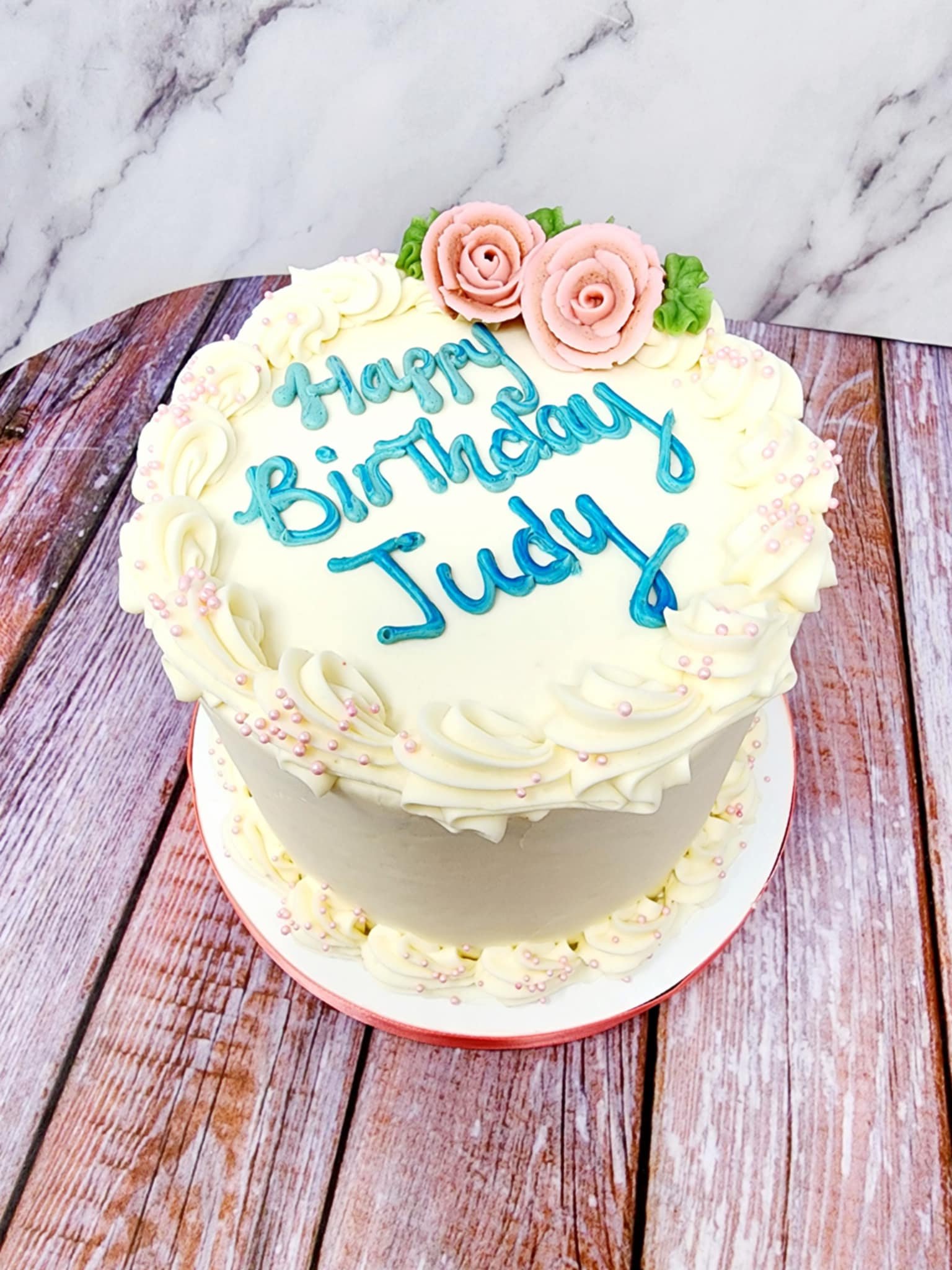 Simple celebration cake.
Available in all frosting options.
2+ rose colors +$5