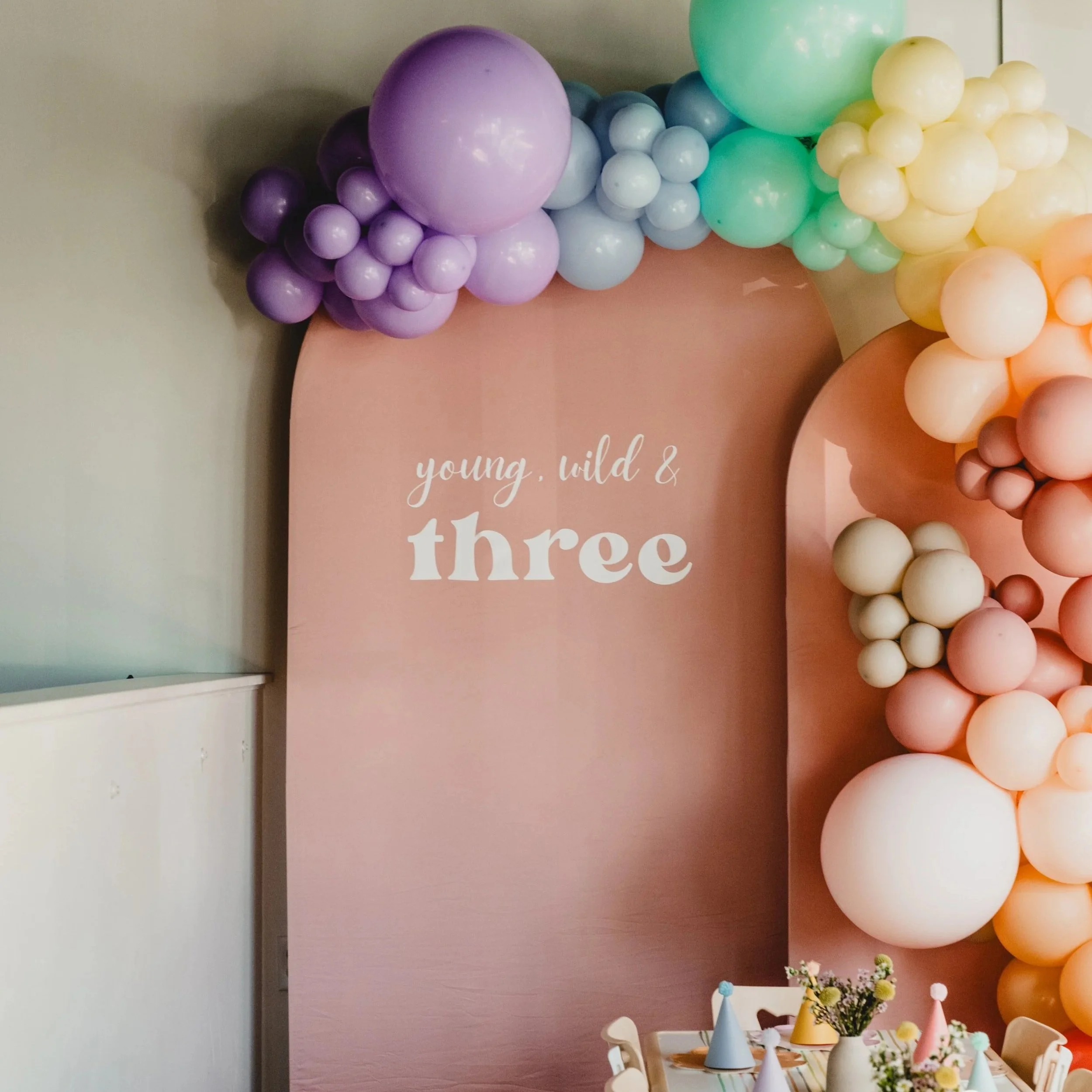 Arched Backdrops with dusty rose colored covers