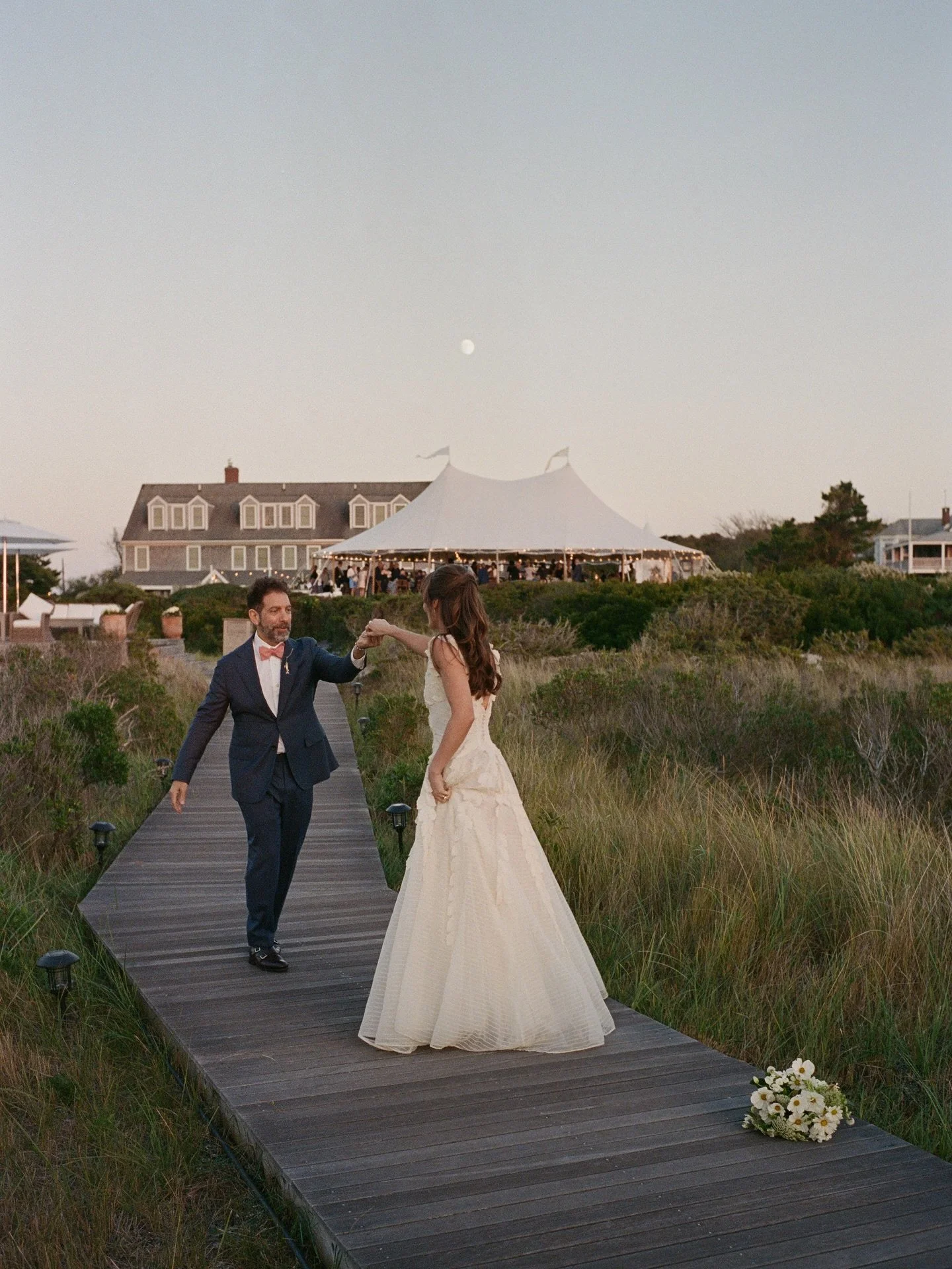 Lainey &amp; Daniel practicing their first dance at dusk 🤍 The weekend kicked off with tattoos and tarot readings and wrapped up with them skinny dipping in the ocean under the stars &mdash; a dream weekend with such a fun group! Planned beautifully
