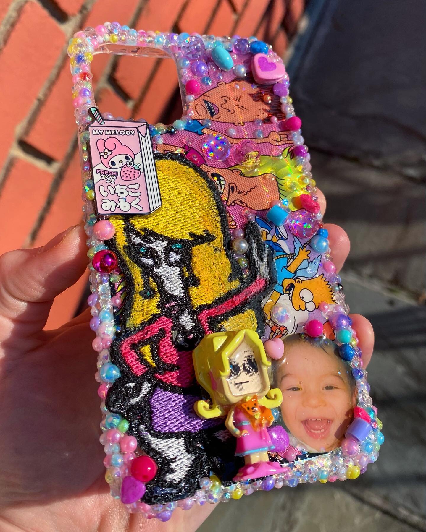Custom Case for someone sweet! Ft a vintage beavis n butthead sticker, a 00s pixel chix toy, a My Melody pin, a 90s Bart sticker, a Roger patch, and a cutie pic of her son 💓sometimes the least likely of items to go together end up fitting perfectly 