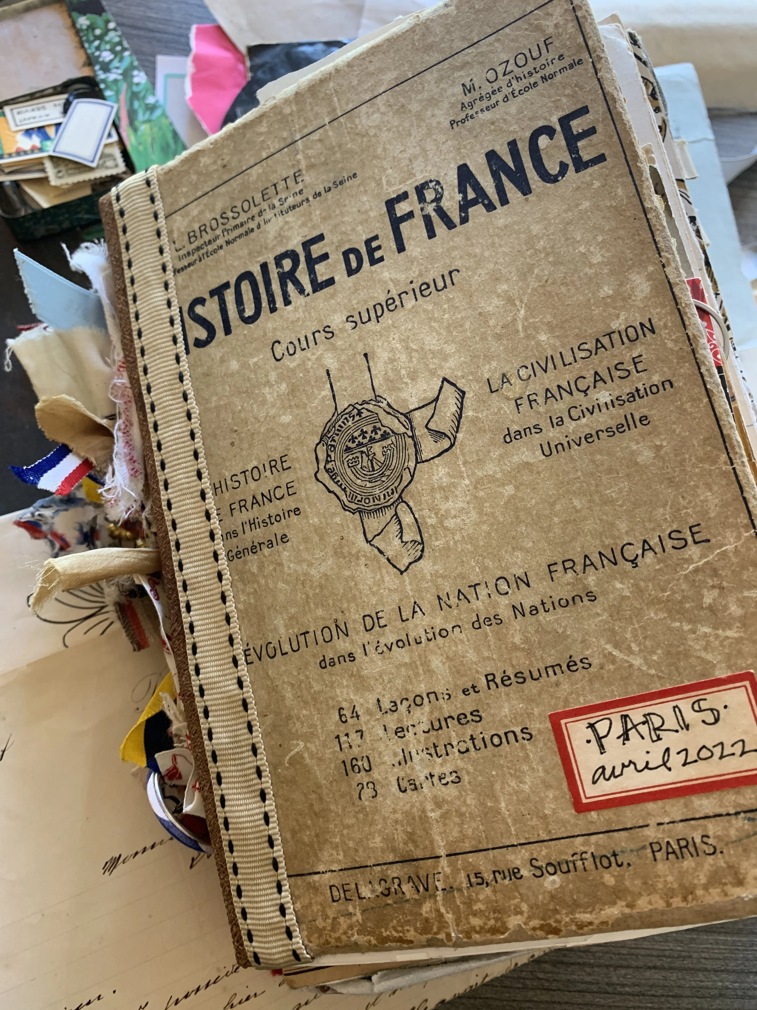 the author's Paris travel journal, made from a vintage French book found at the flea market