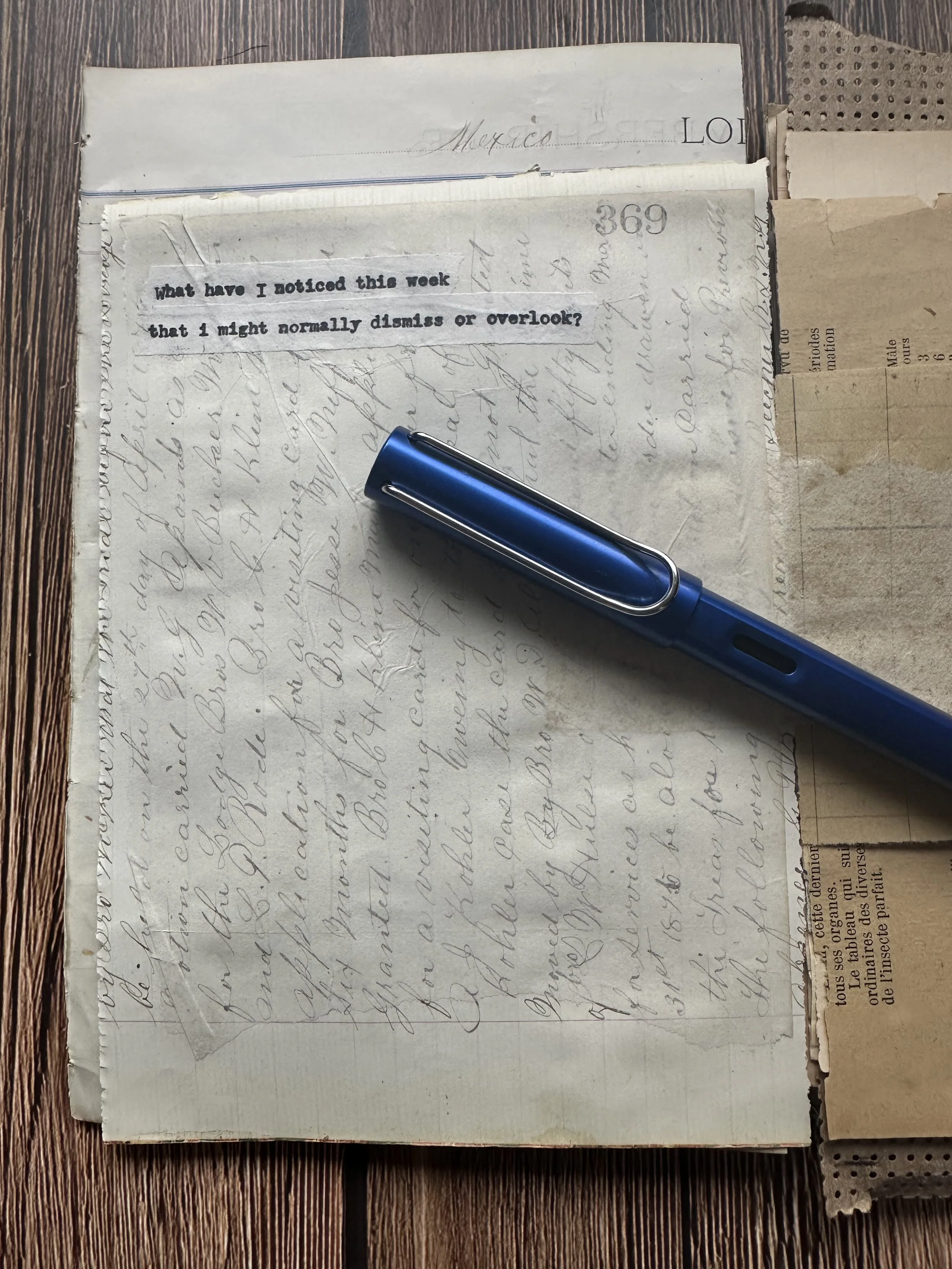 Open journal with gentle writing prompt and fountain pen, ready for reflection.