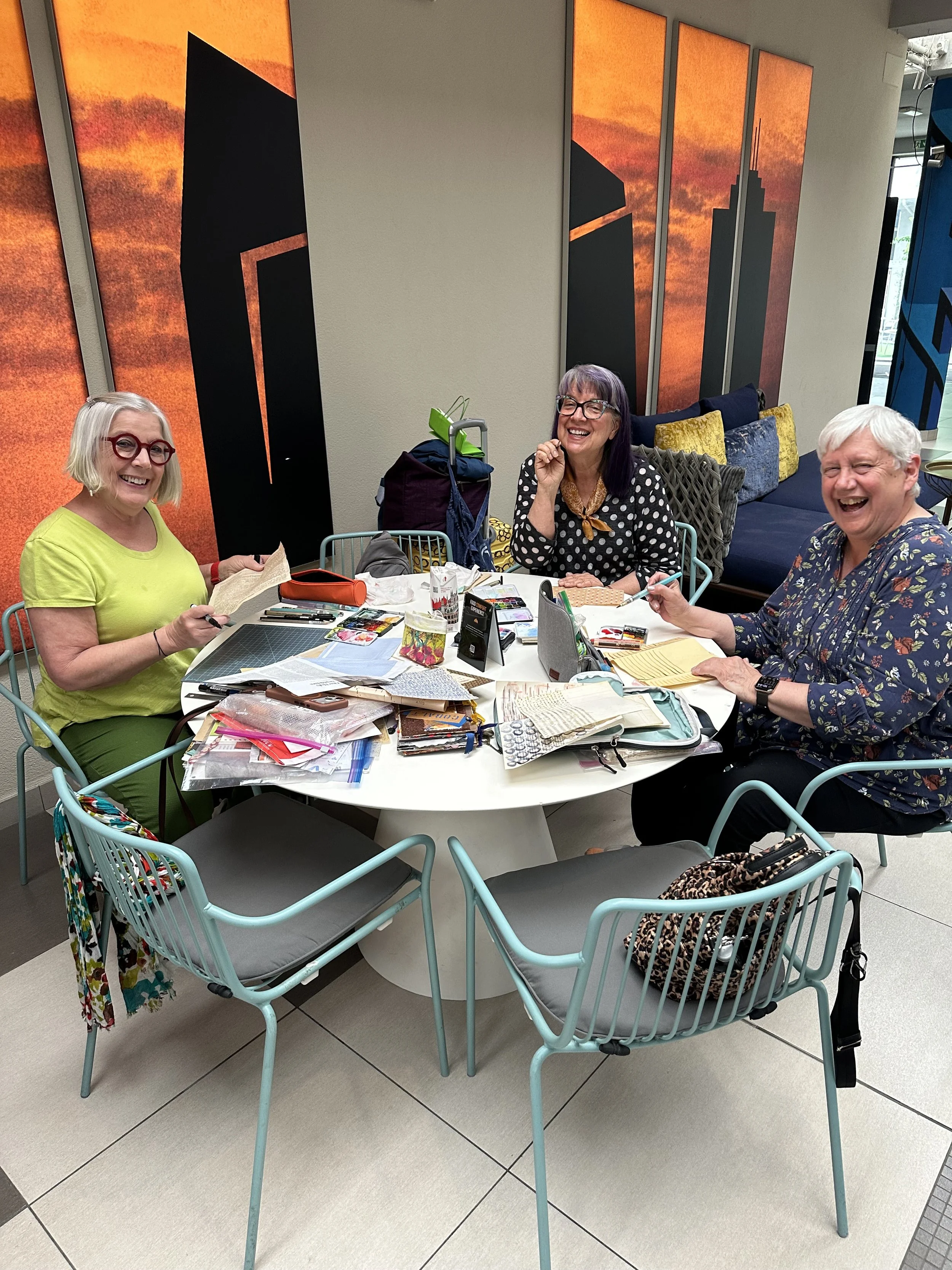 Women gathering for art journaling and creative reflection in Italy.